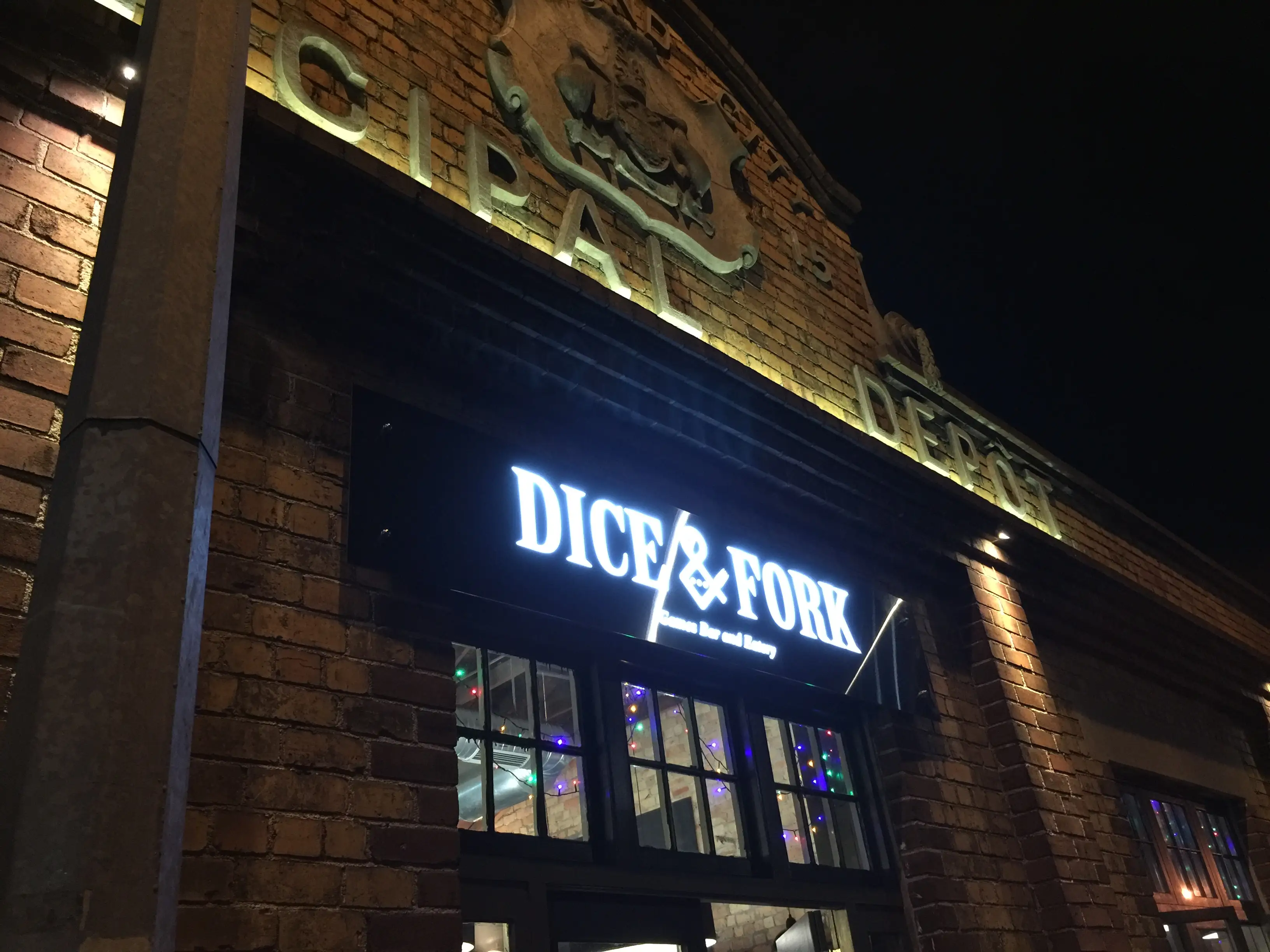 Venue lettering and graphic mark within the hospitality interior.