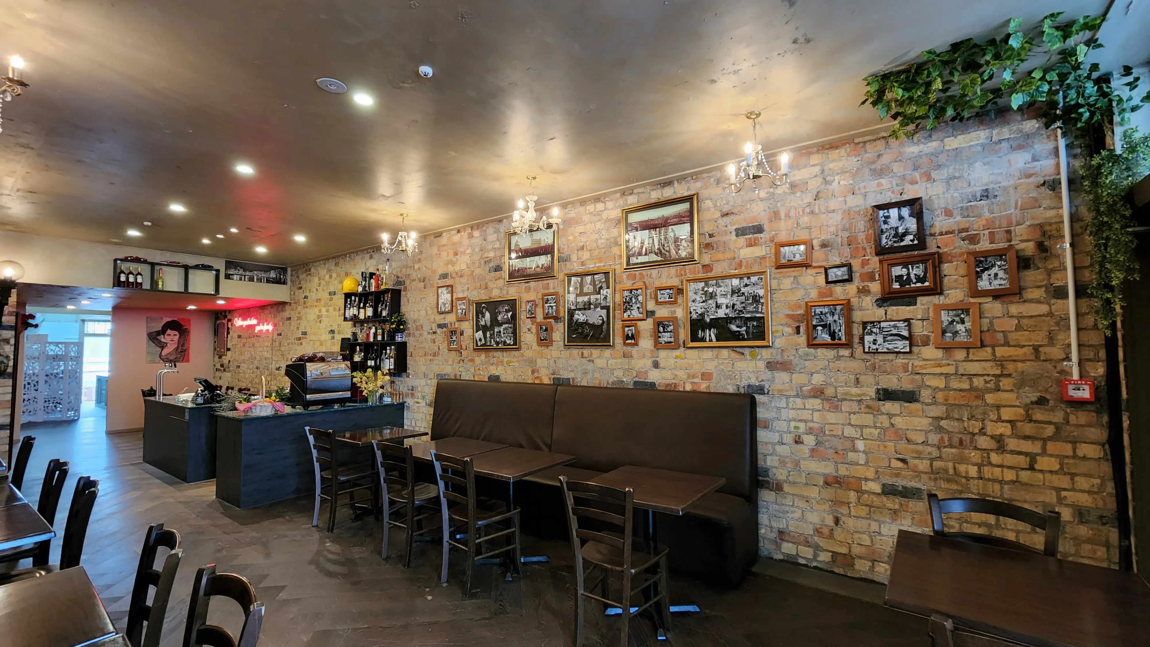Hospitality seating, lighting and brand details.