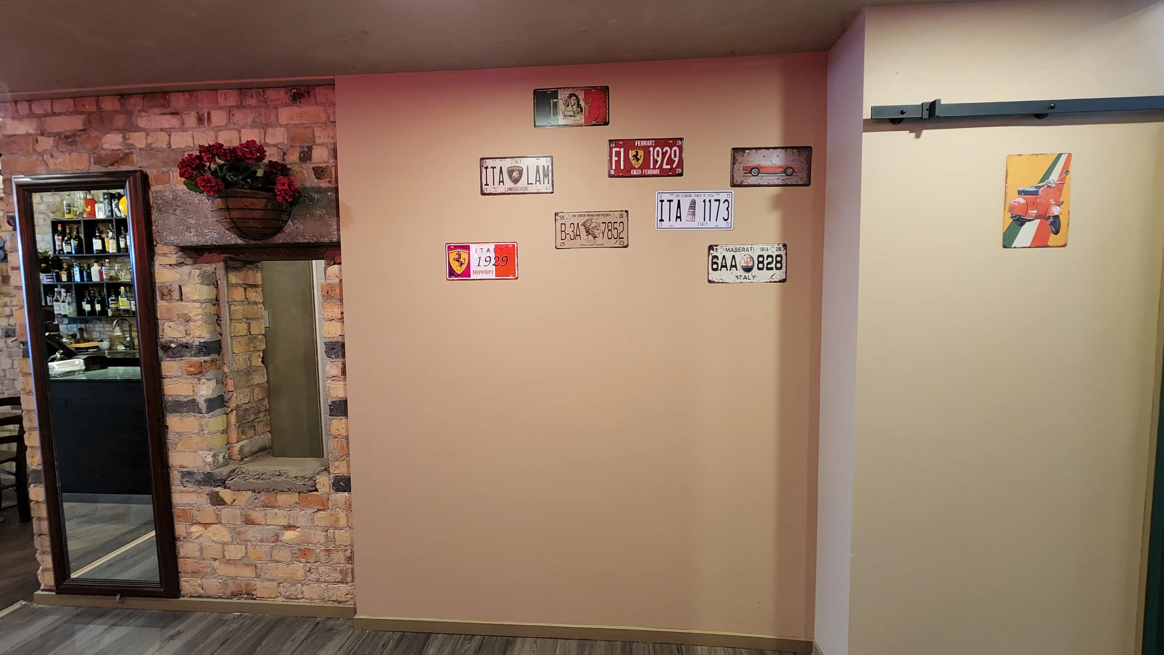 Bona Pizza dining interior with brick finishes and layered displays.