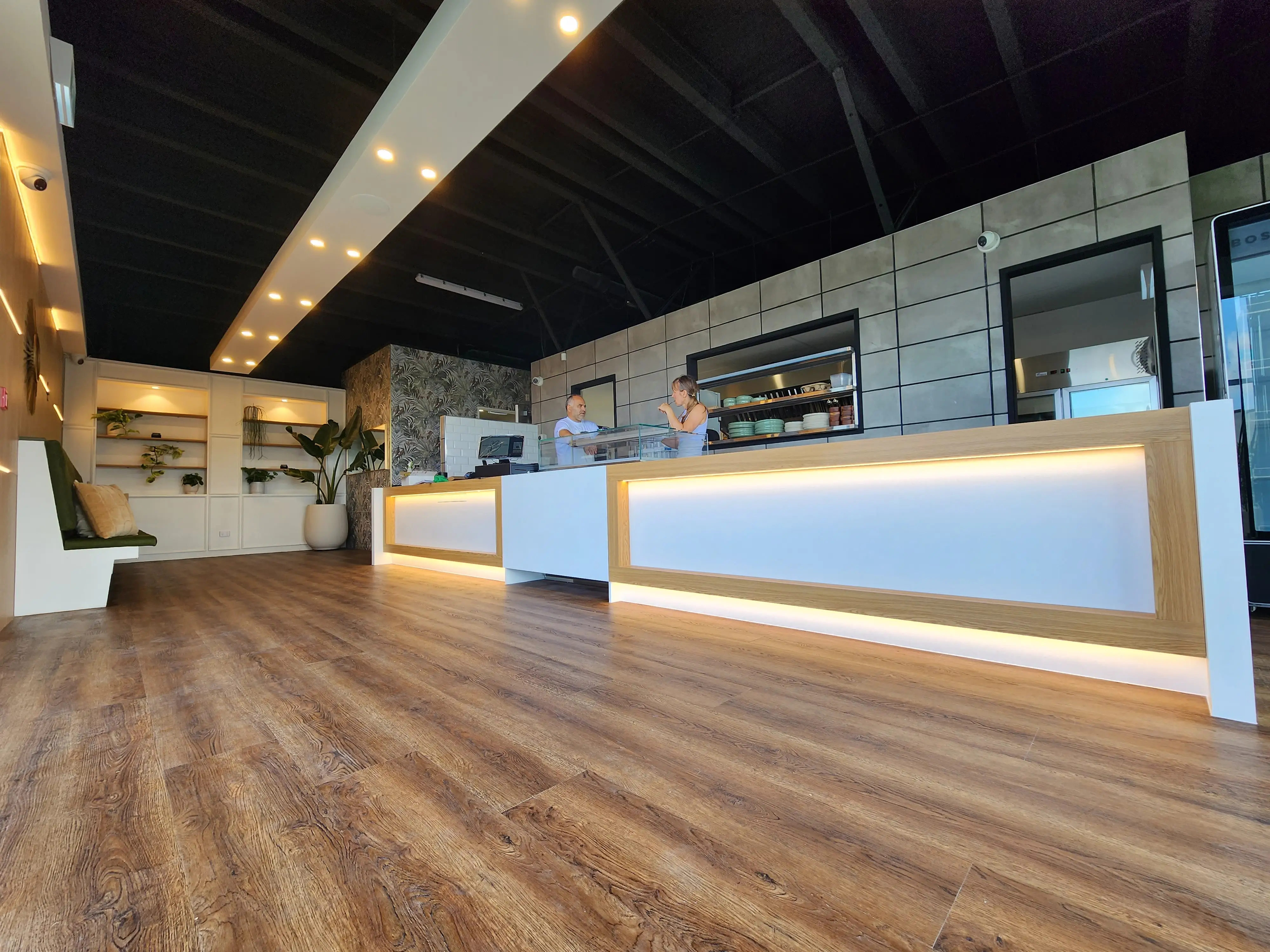 Customer and service areas within the completed café.