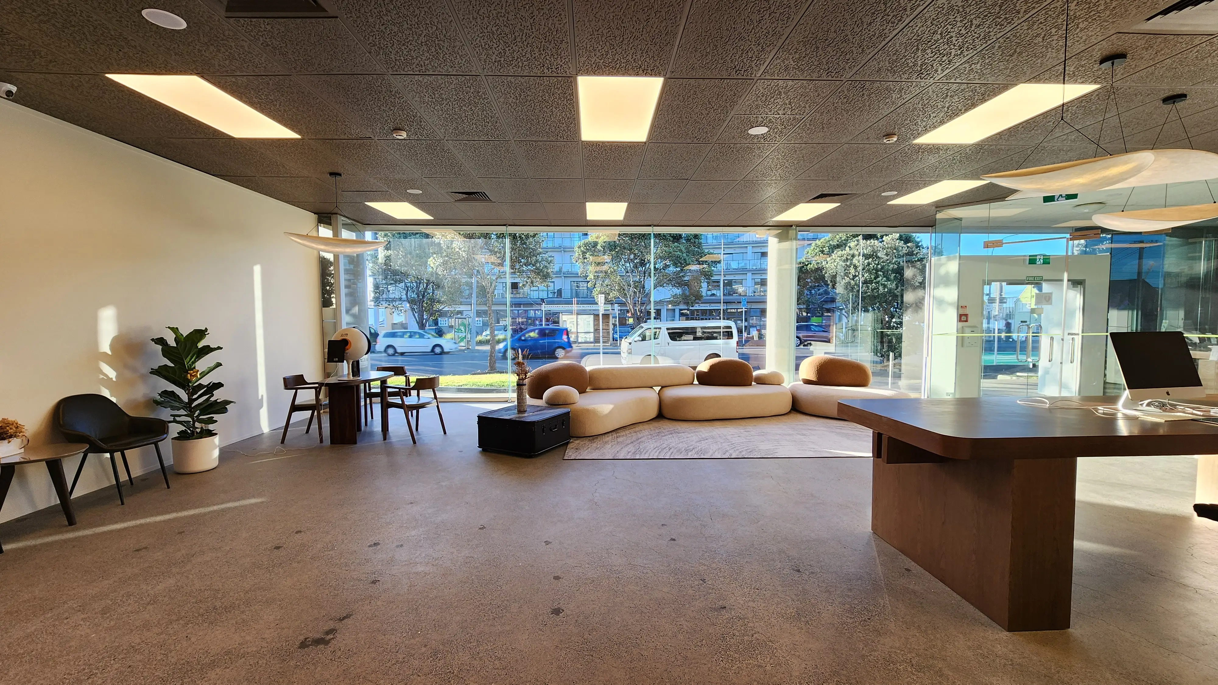 Curved openings connect the reception and adjoining interior spaces.