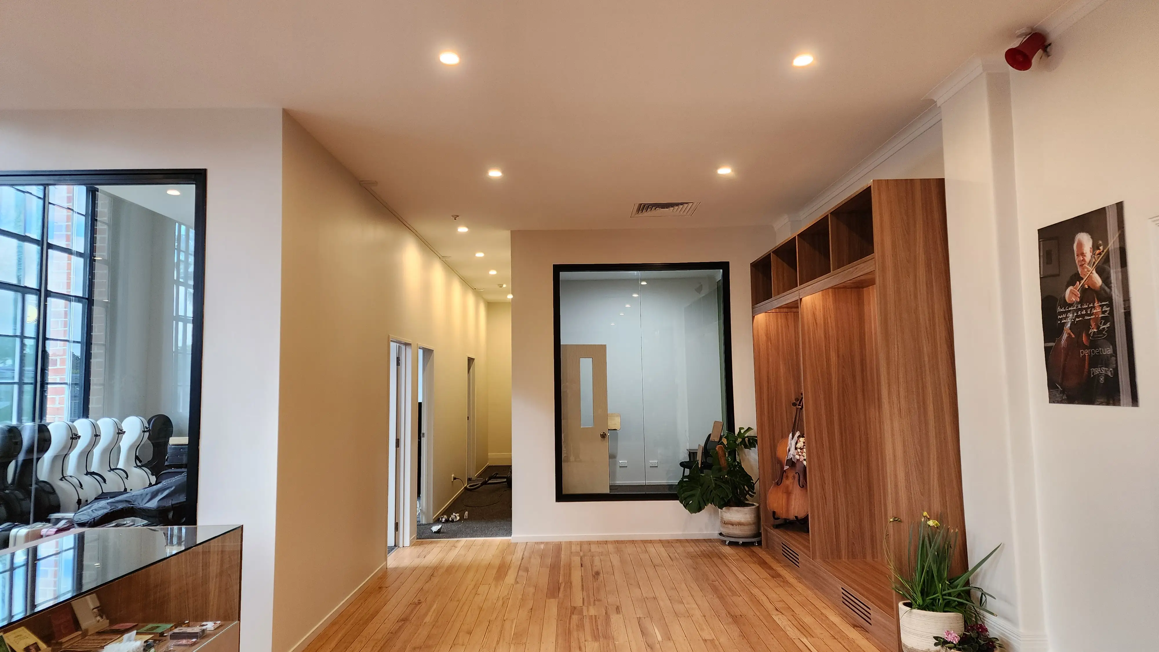 Timber-slat wall treatment within the completed music interior.