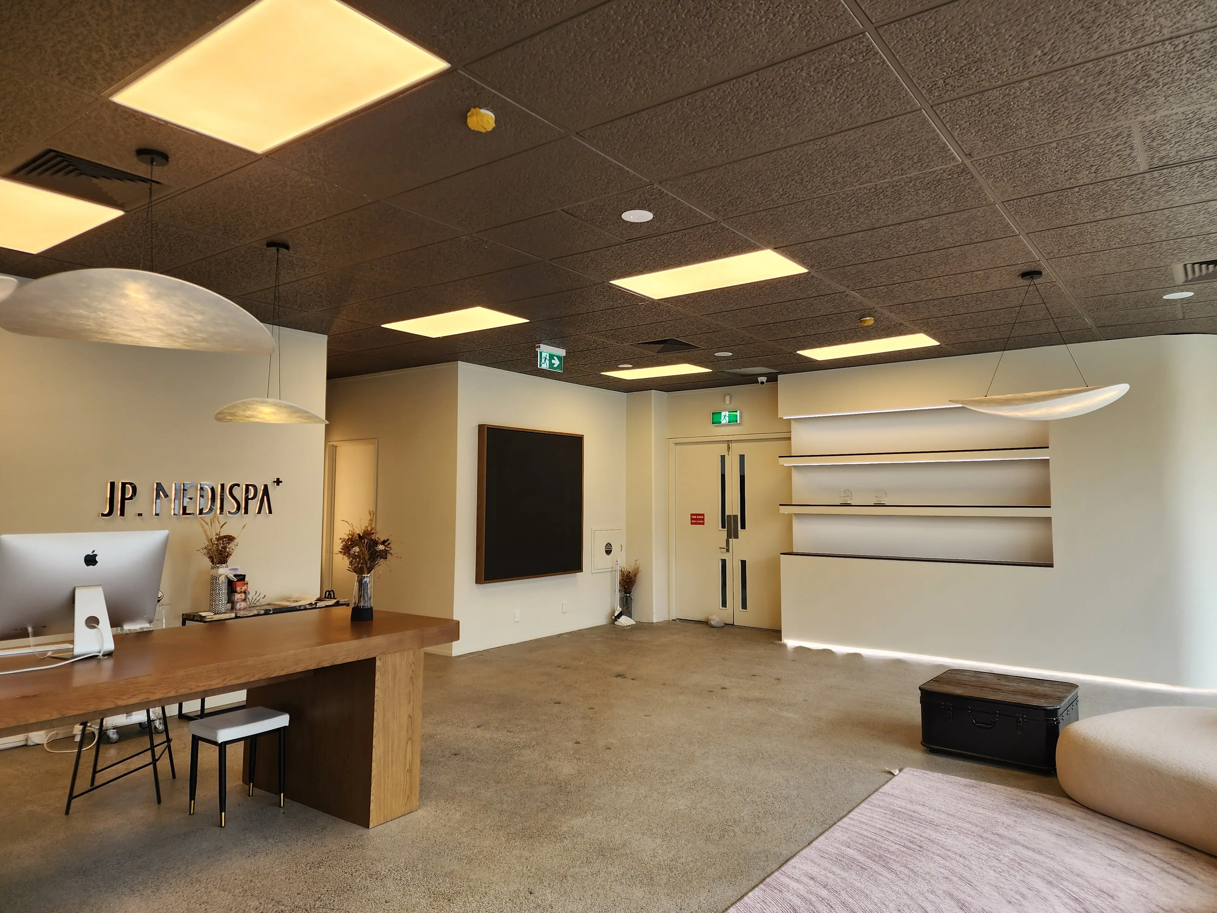 Joinery and illuminated details within the completed wellness interior.