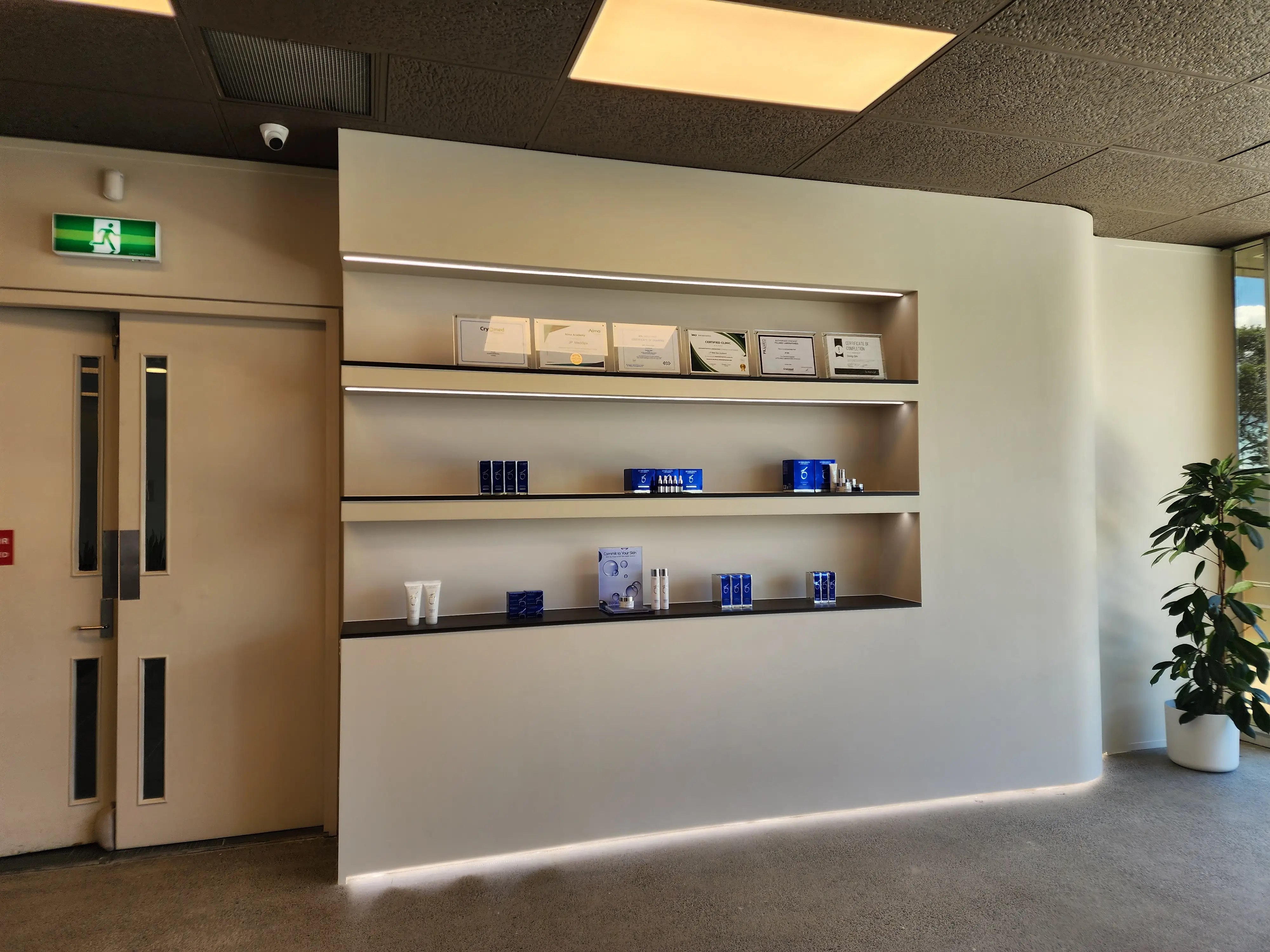 JP Medi Spa reception with recessed product displays and integrated lighting.