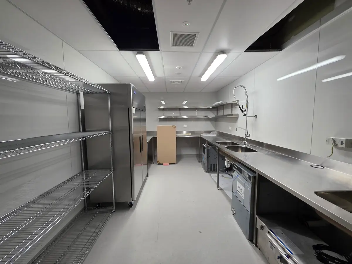 Completed café interior and operational details.