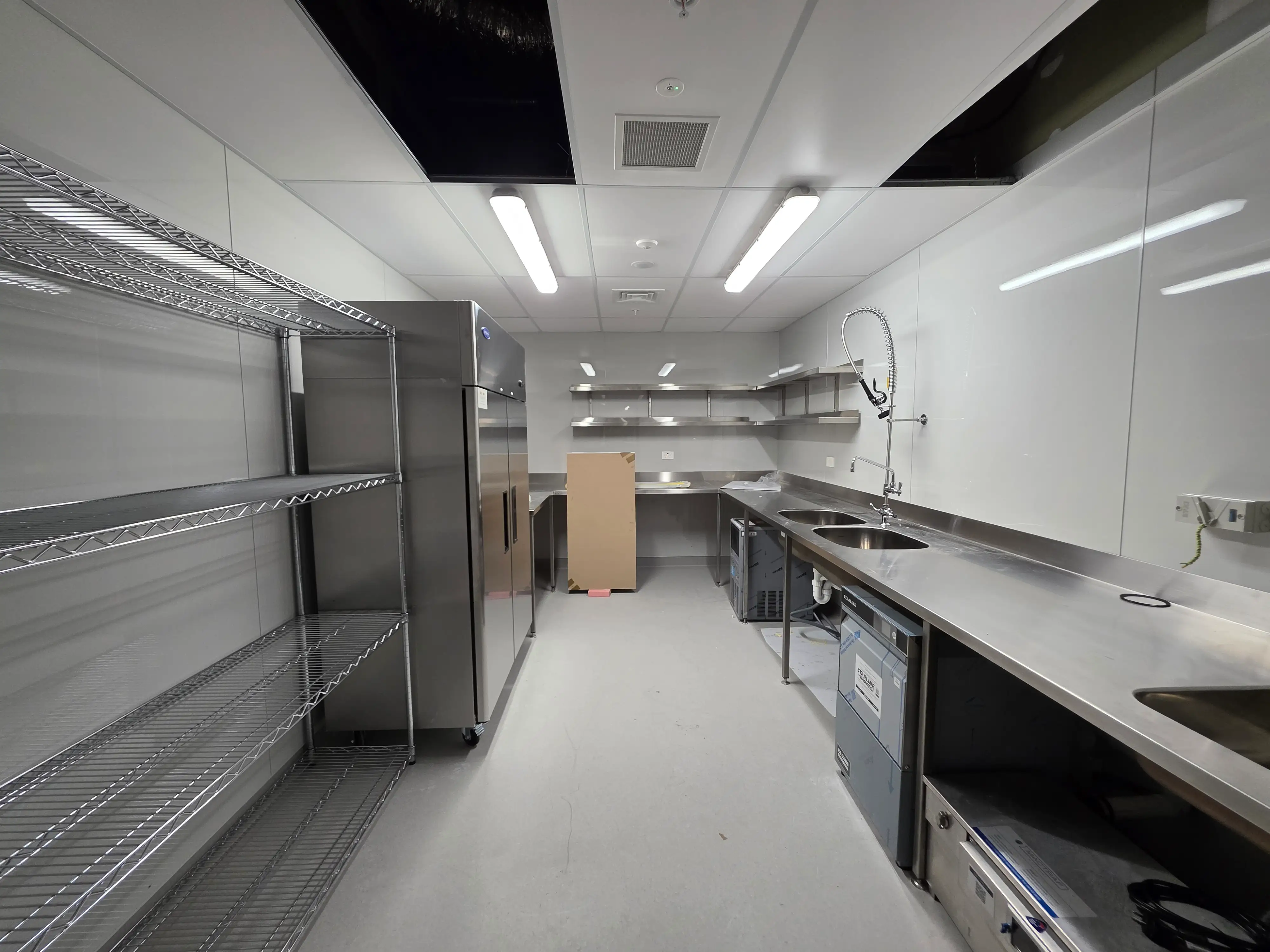 Completed café interior and operational details.