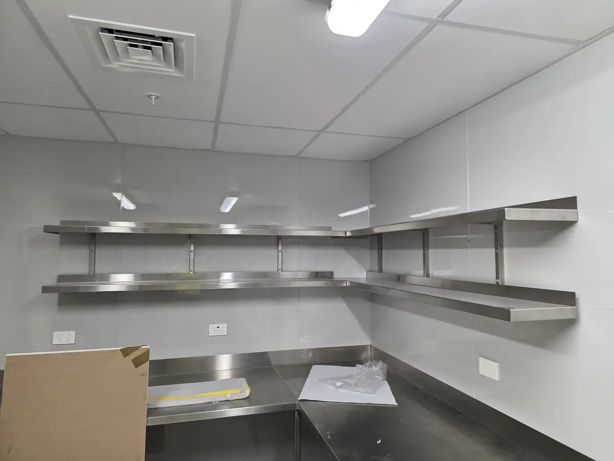 Reheat Cafe service area with timber-fronted counter joinery.