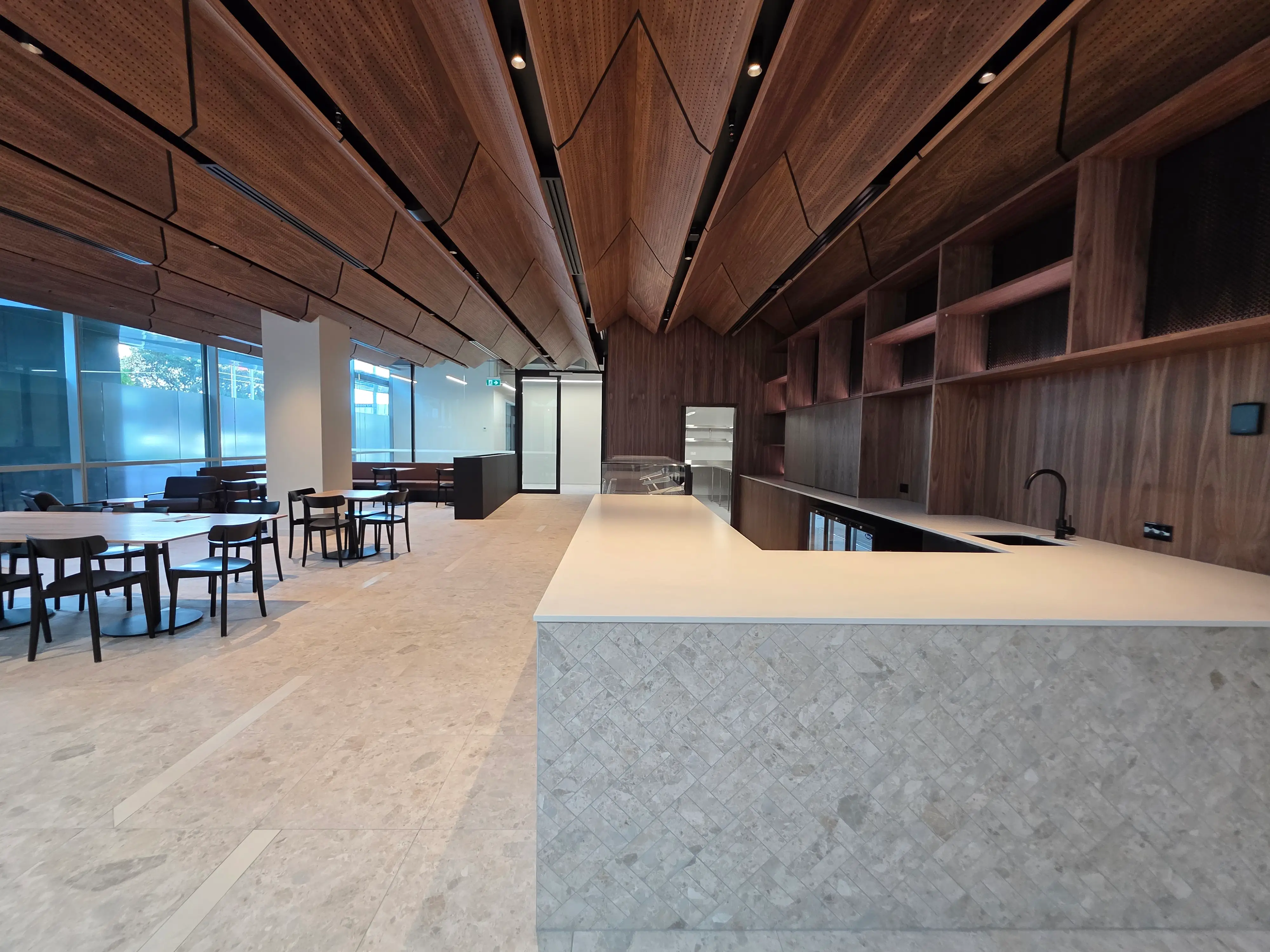 Reheat Cafe service area with timber-fronted counter joinery.