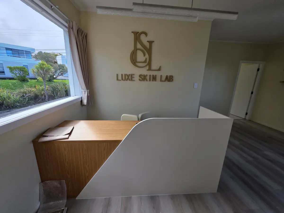 Illuminated Luxe Skin Lab identity within the completed interior.
