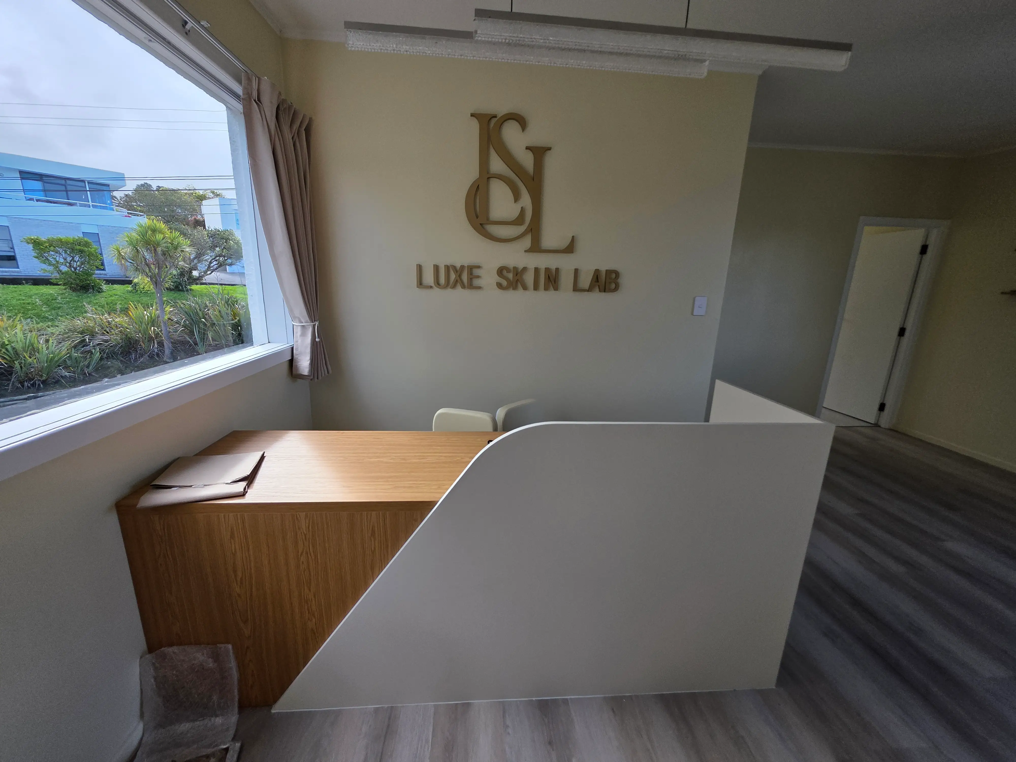 Illuminated Luxe Skin Lab identity within the completed interior.