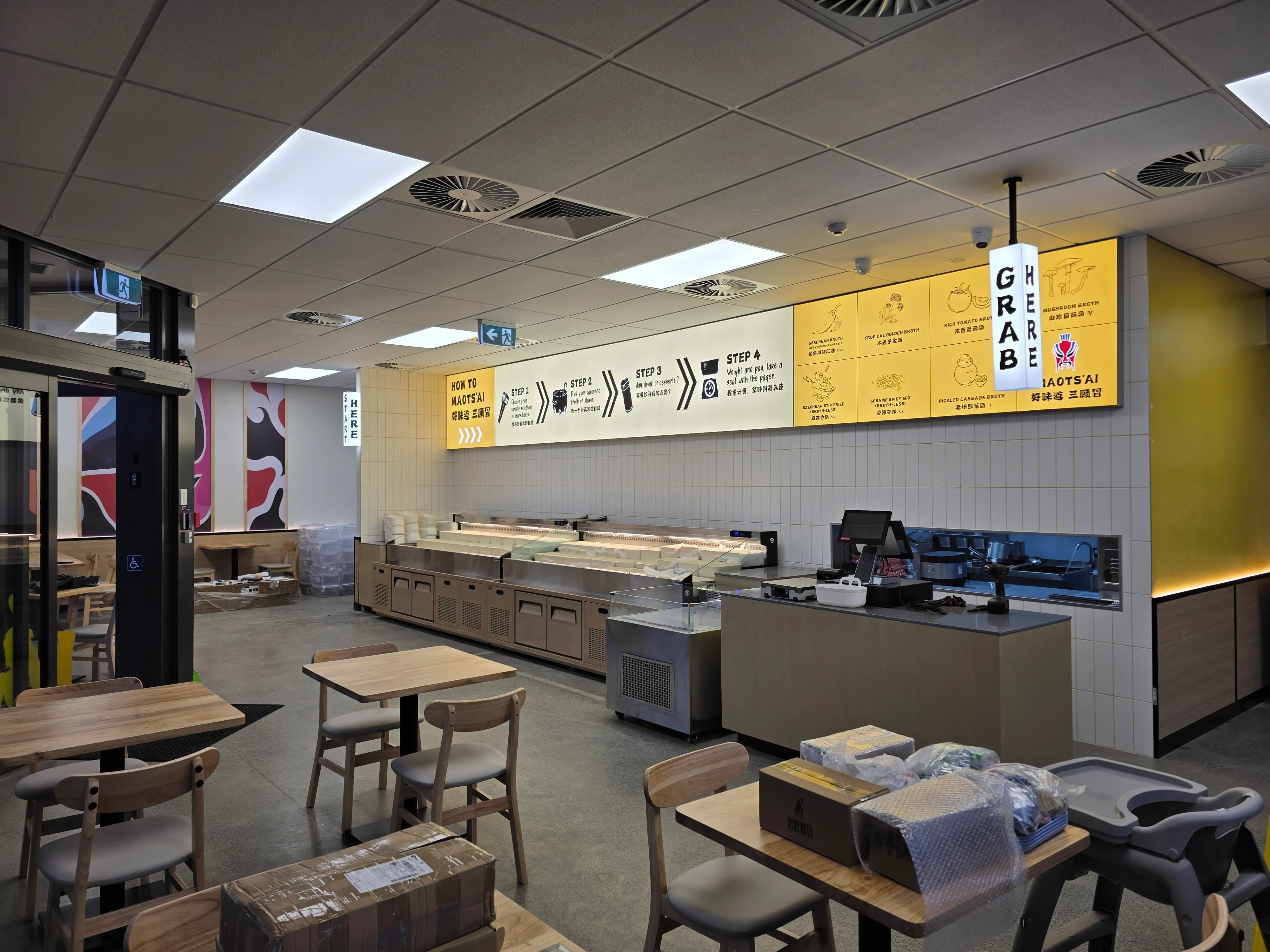 Ordering counter and kitchen interface within the restaurant.