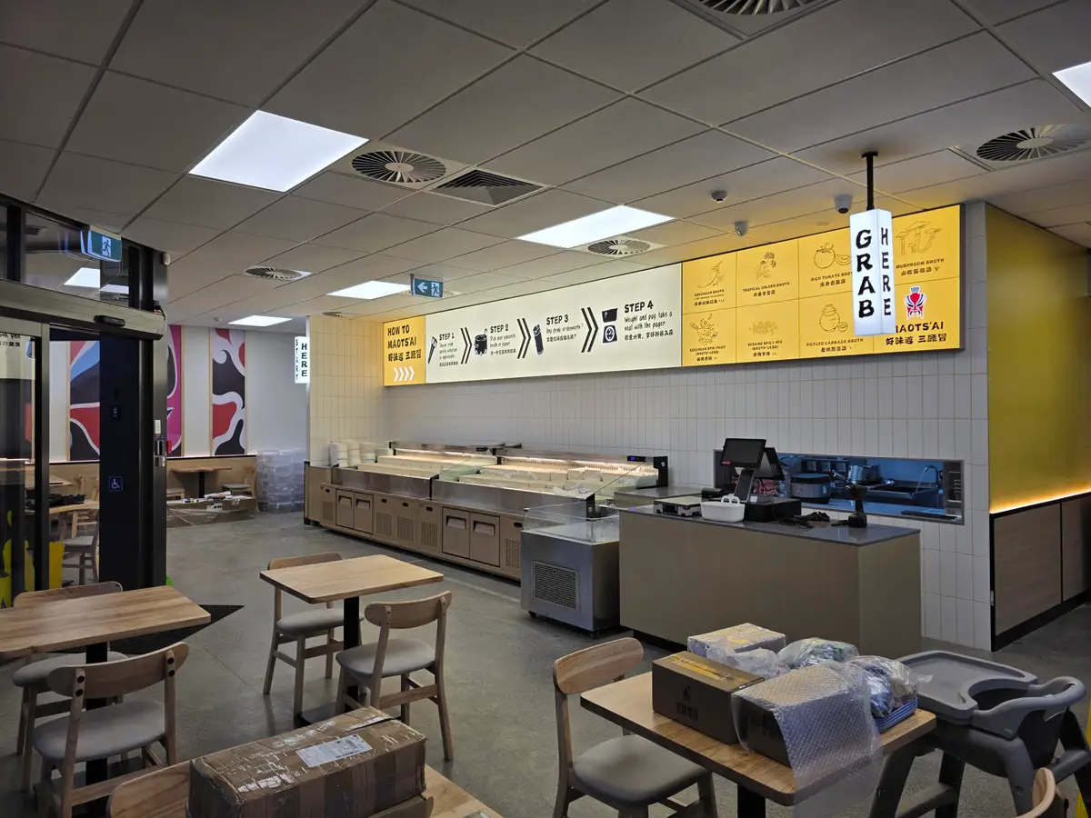 Ordering counter and kitchen interface within the restaurant.