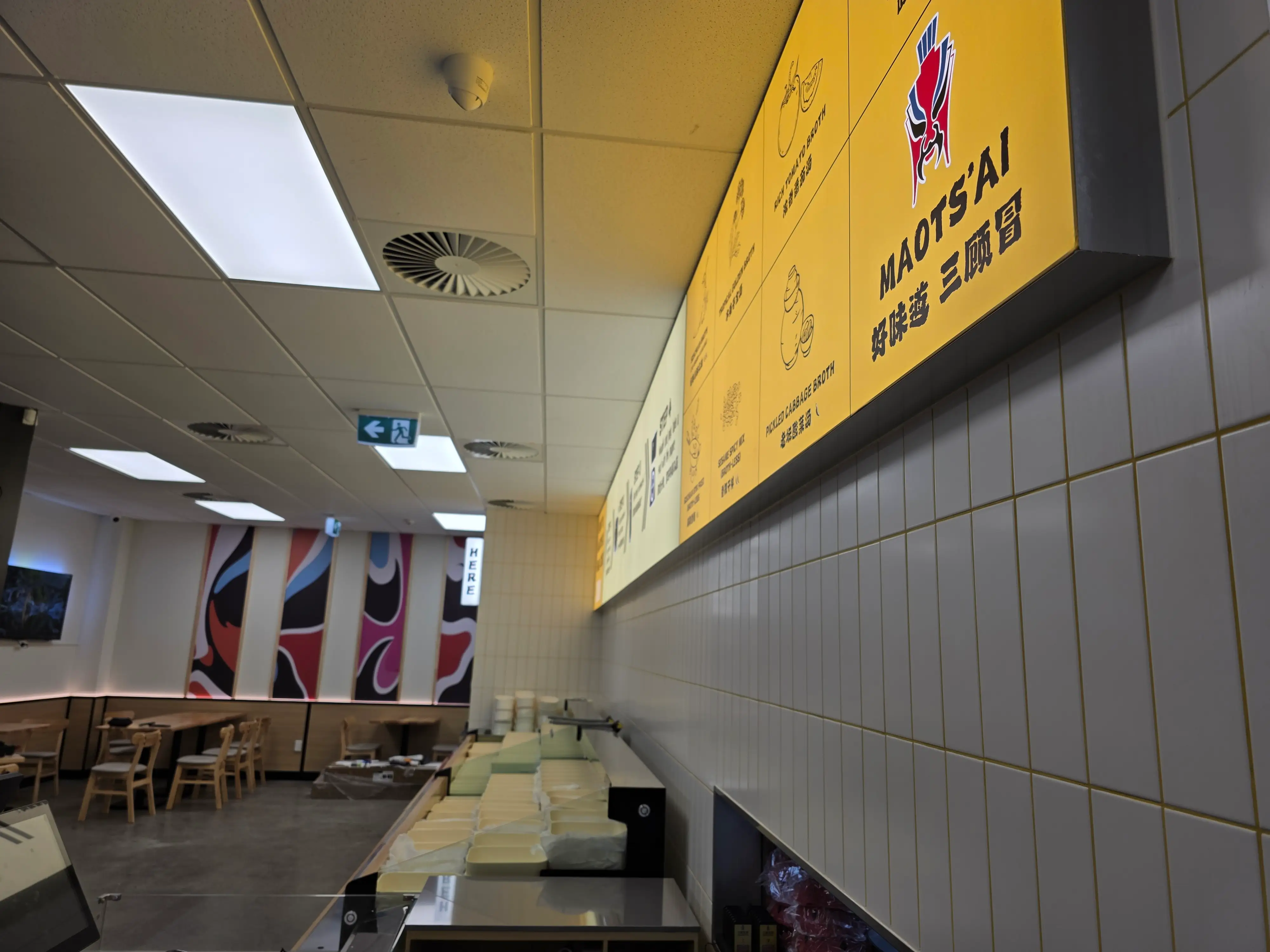Ordering counter and kitchen interface within the restaurant.
