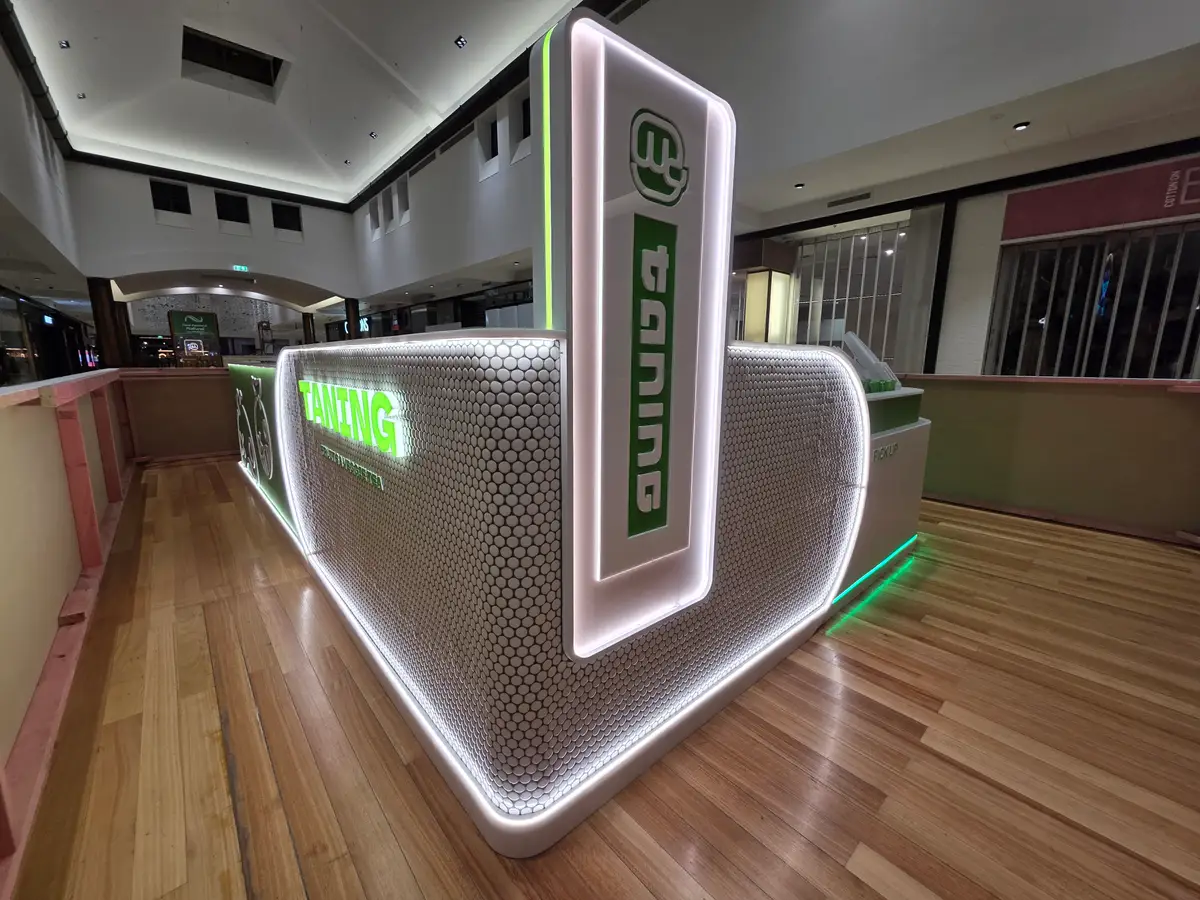Illuminated service counter at TANING Botany Town Centre.