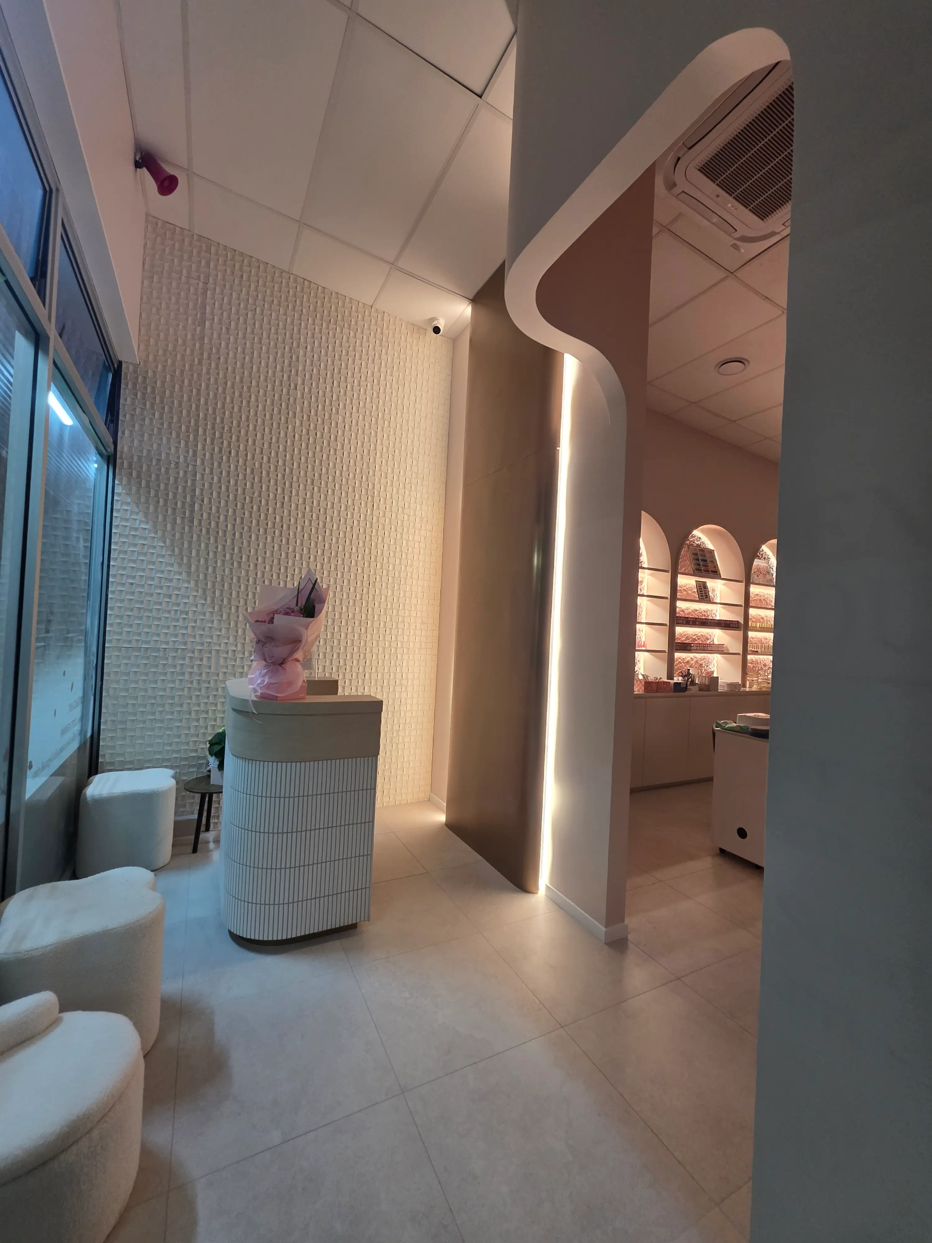 Illuminated brand wall and reception joinery.