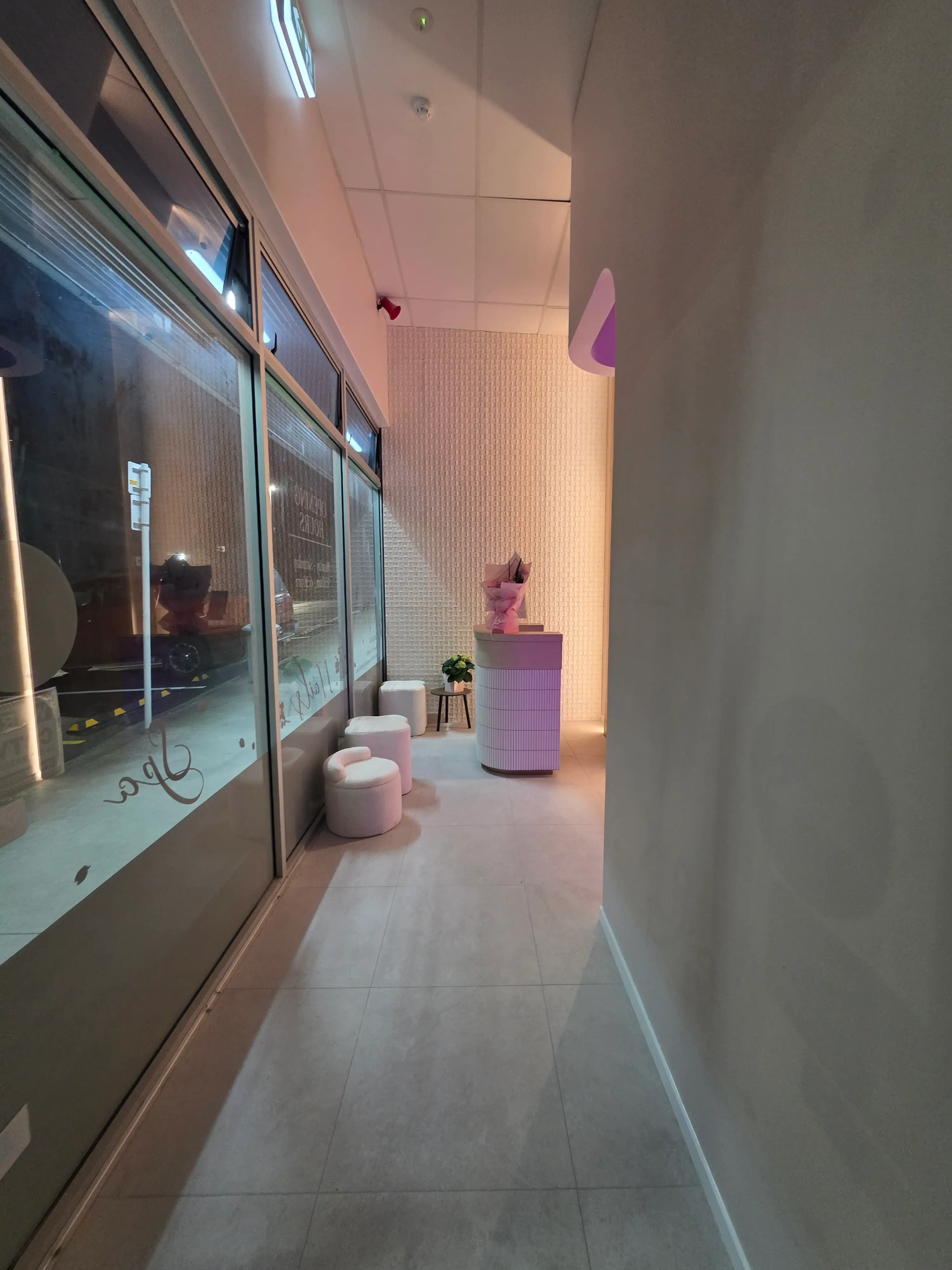 Illuminated brand wall and reception joinery.