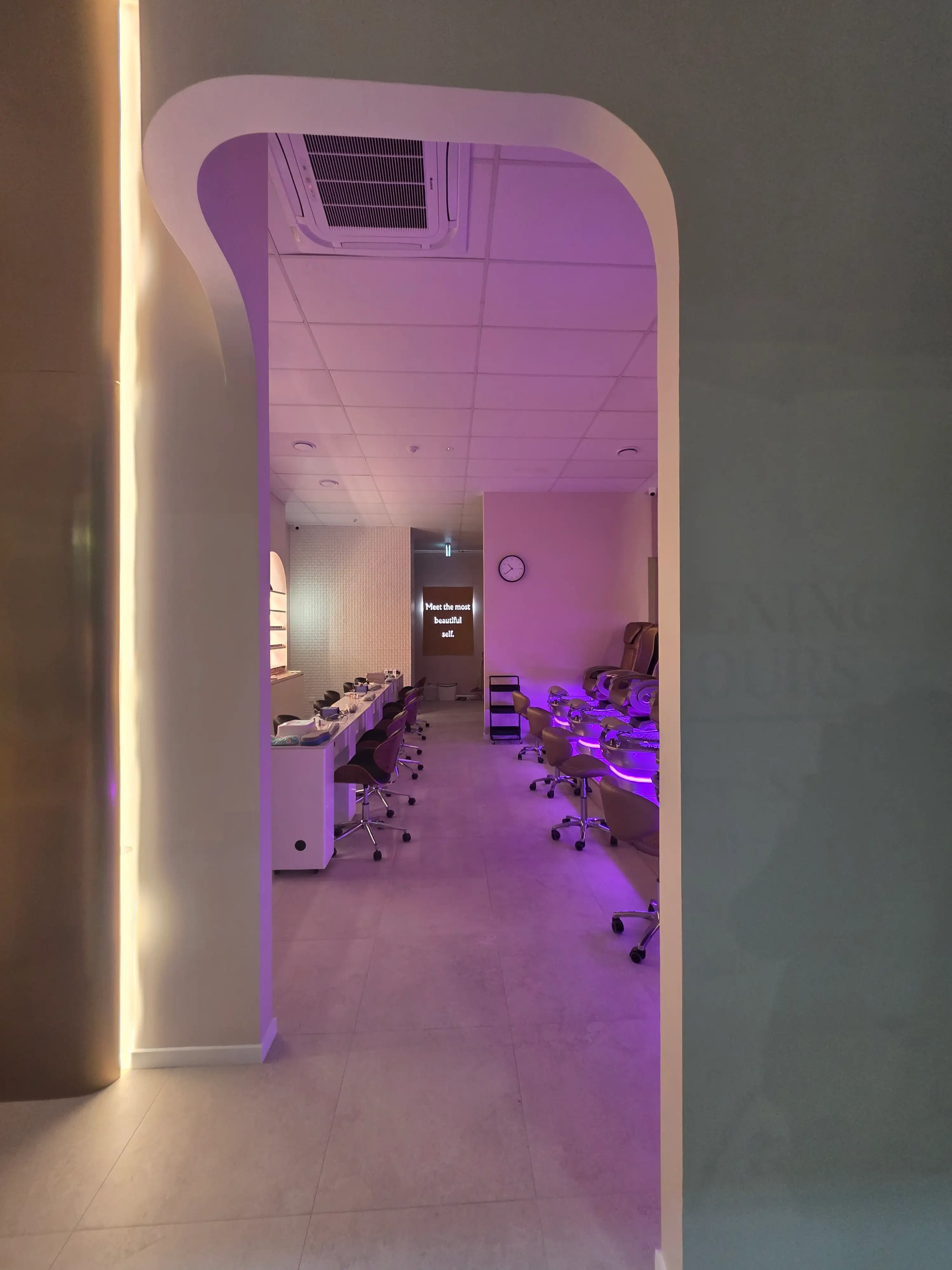 Blossoms Nails & Beauty interior with arched product-display niches.