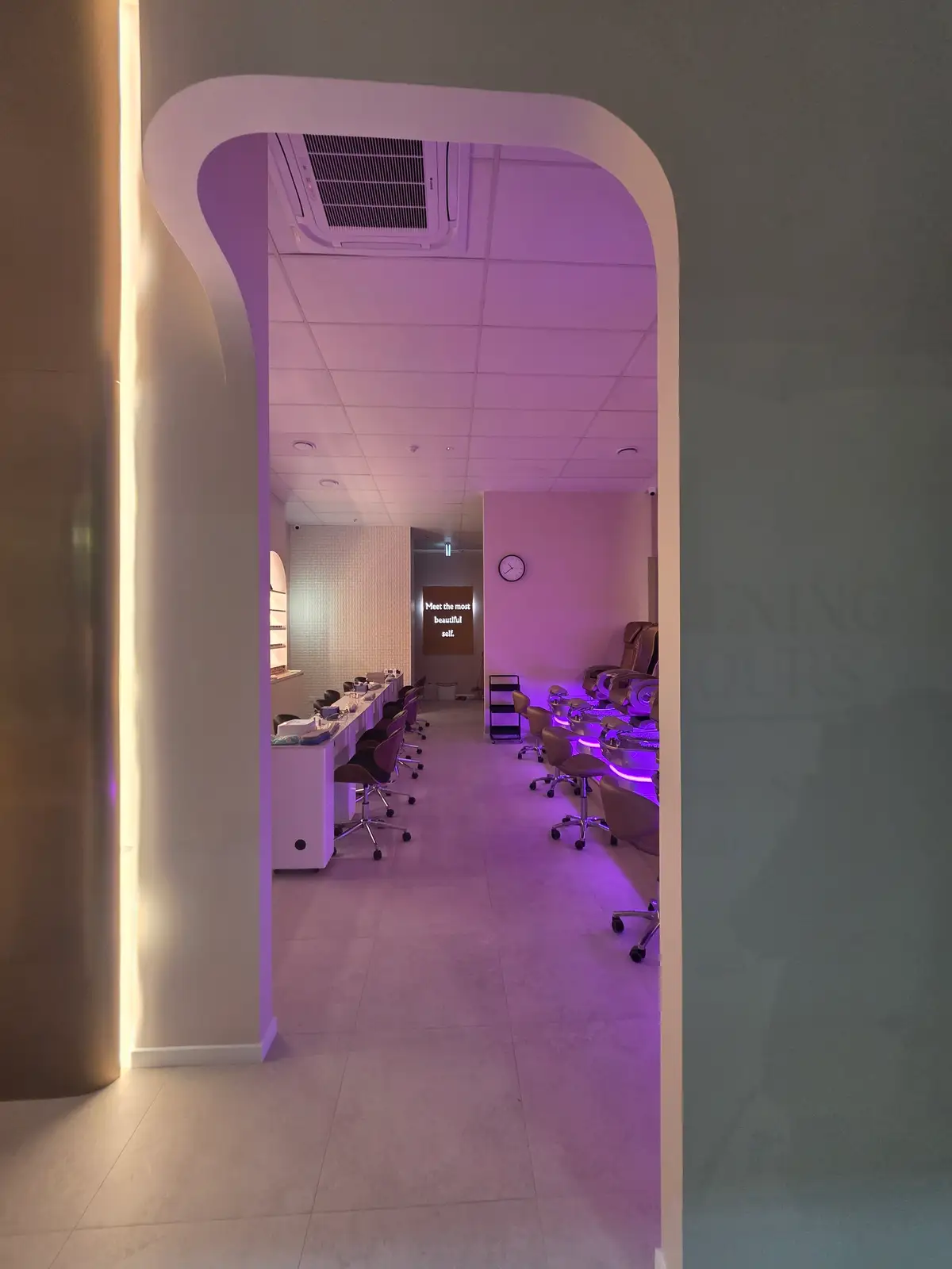 Blossoms Nails & Beauty interior with arched product-display niches.