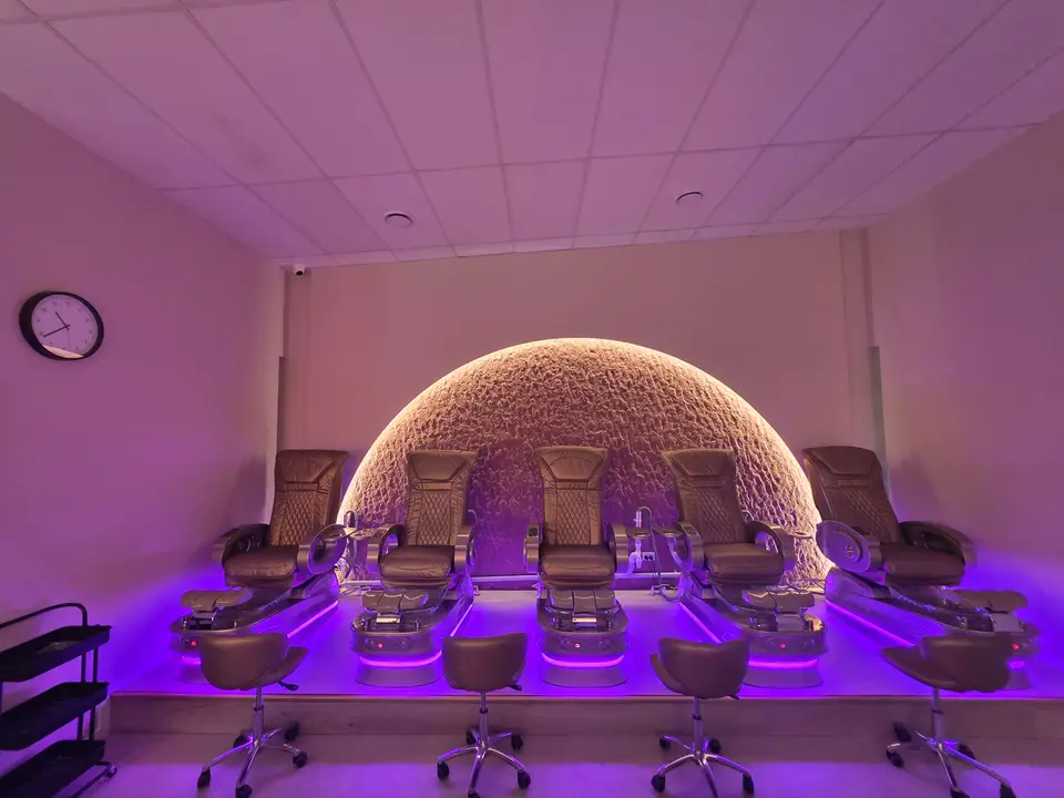 Blossoms Nails & Beauty interior with arched product-display niches.