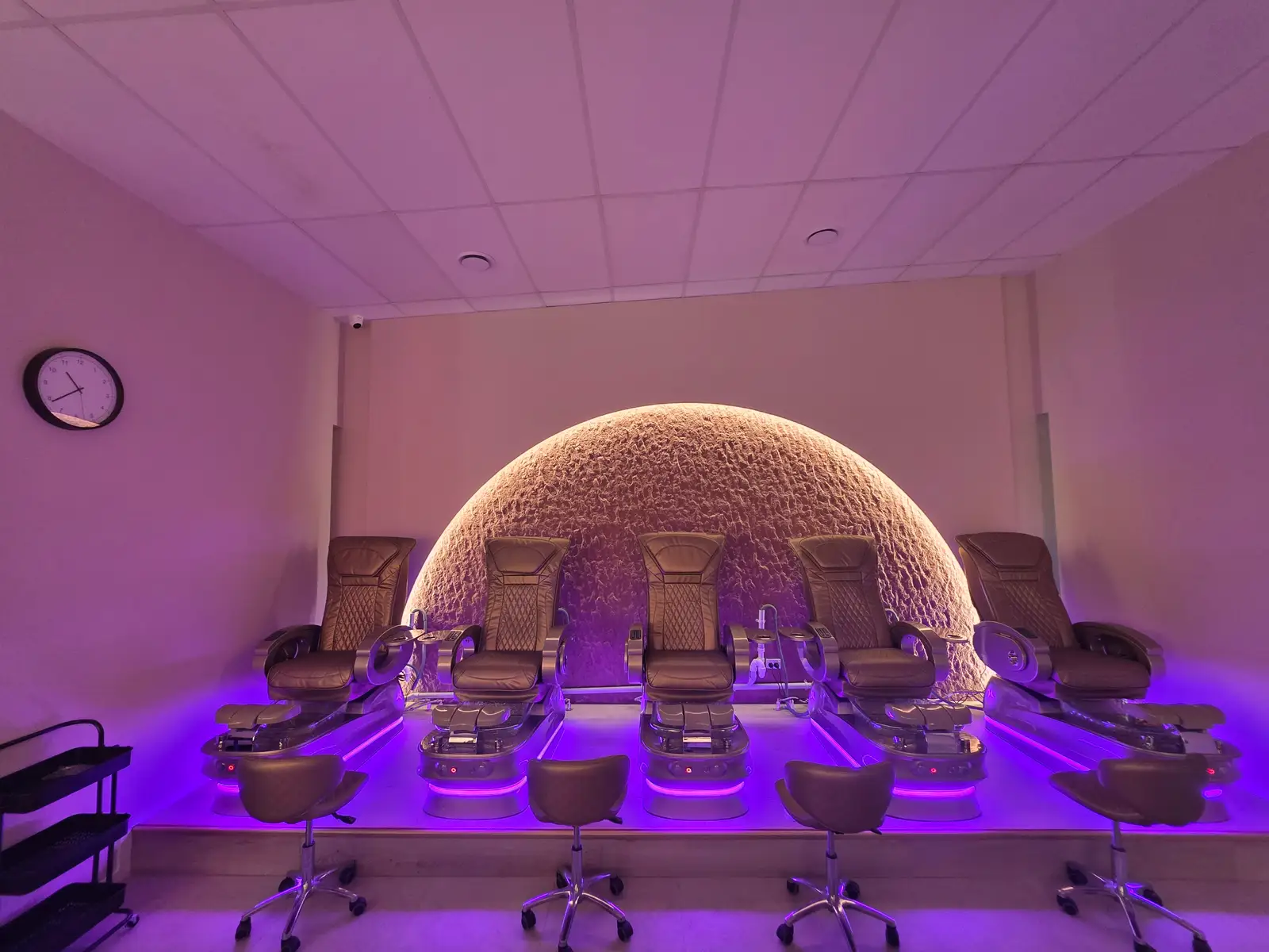 Blossoms Nails & Beauty interior with arched product-display niches.