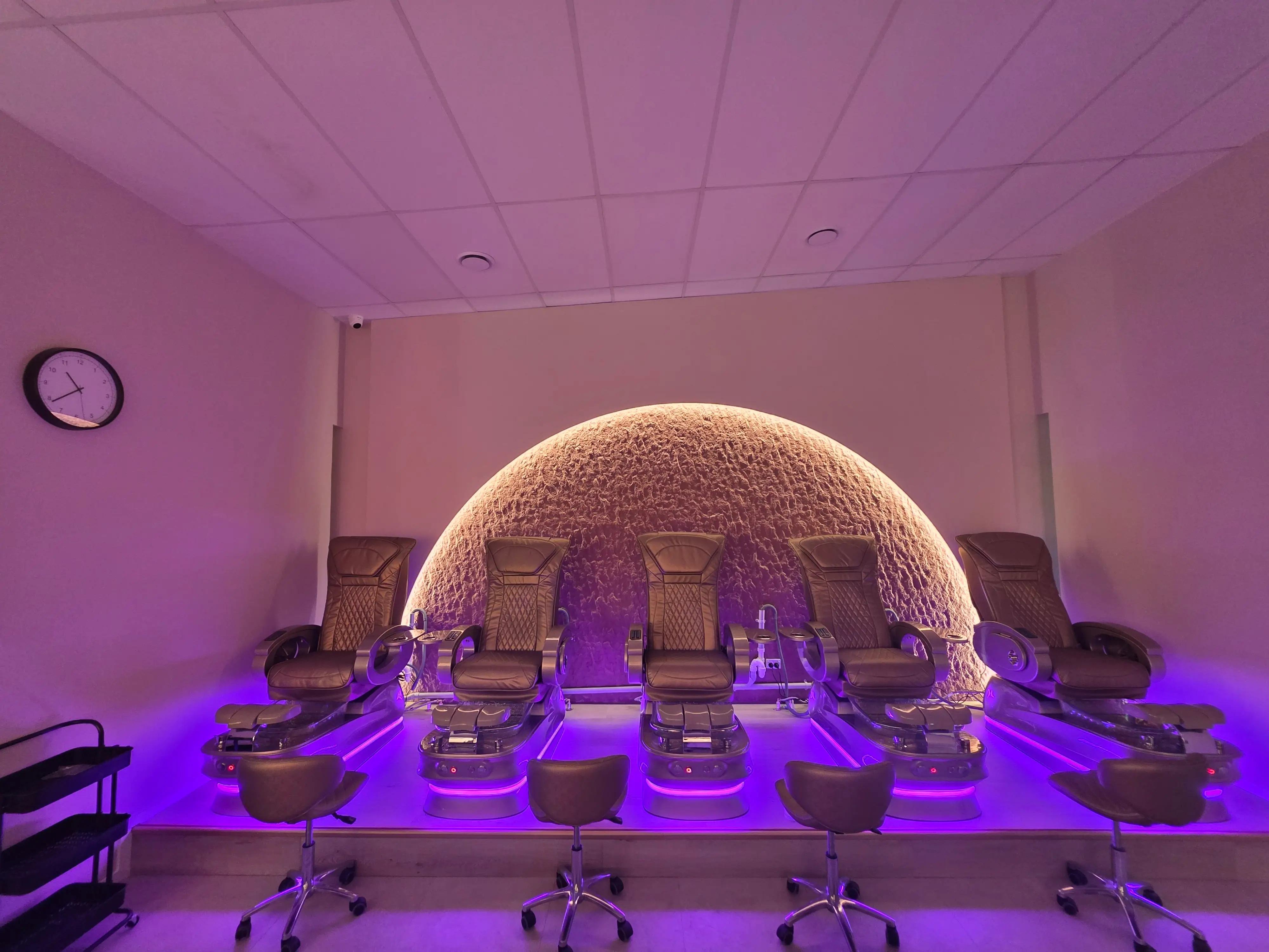 Blossoms Nails & Beauty interior with arched product-display niches.