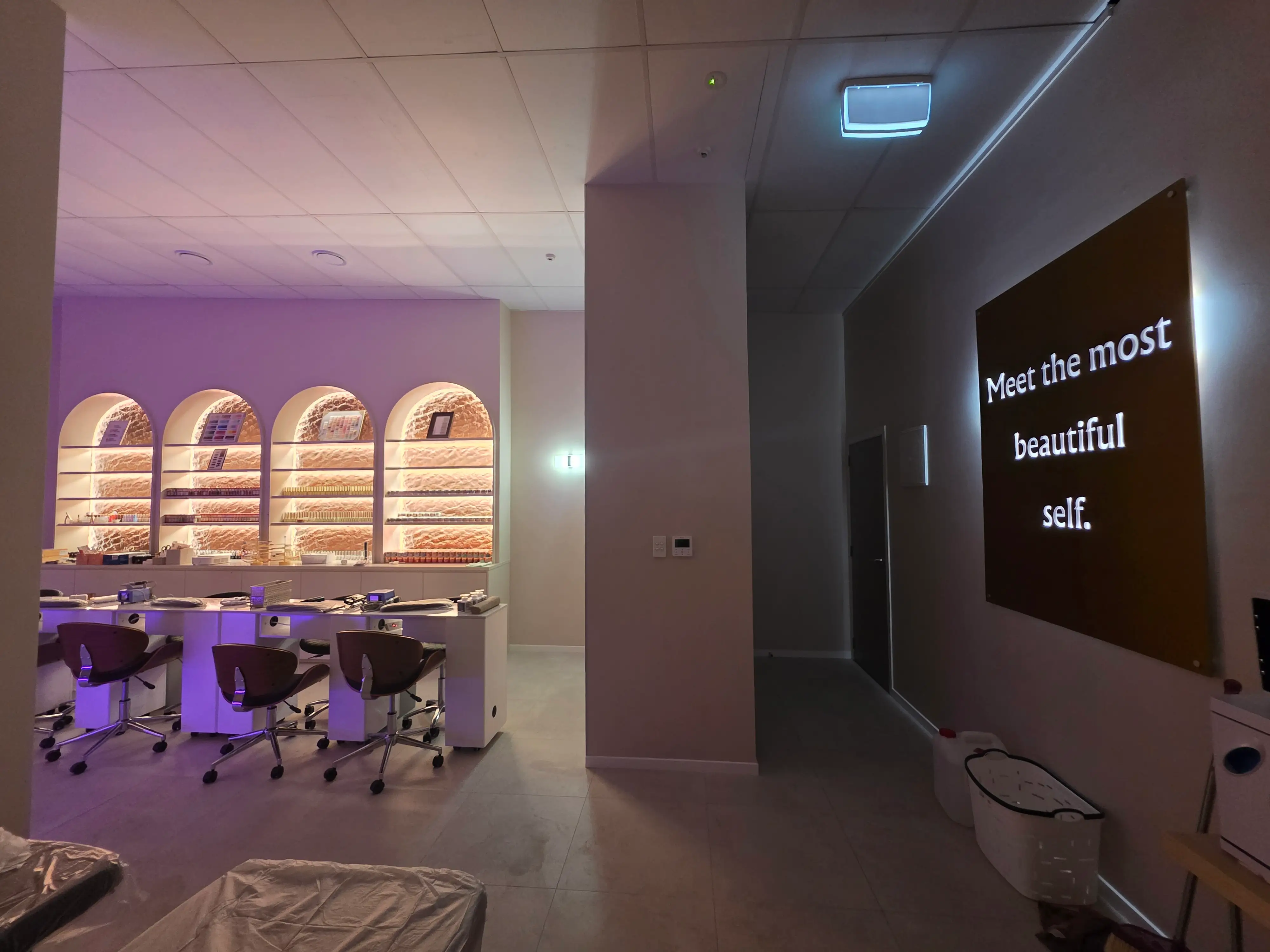 Manicure stations arranged through the completed salon.