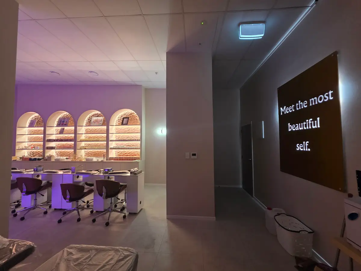 Manicure stations arranged through the completed salon.