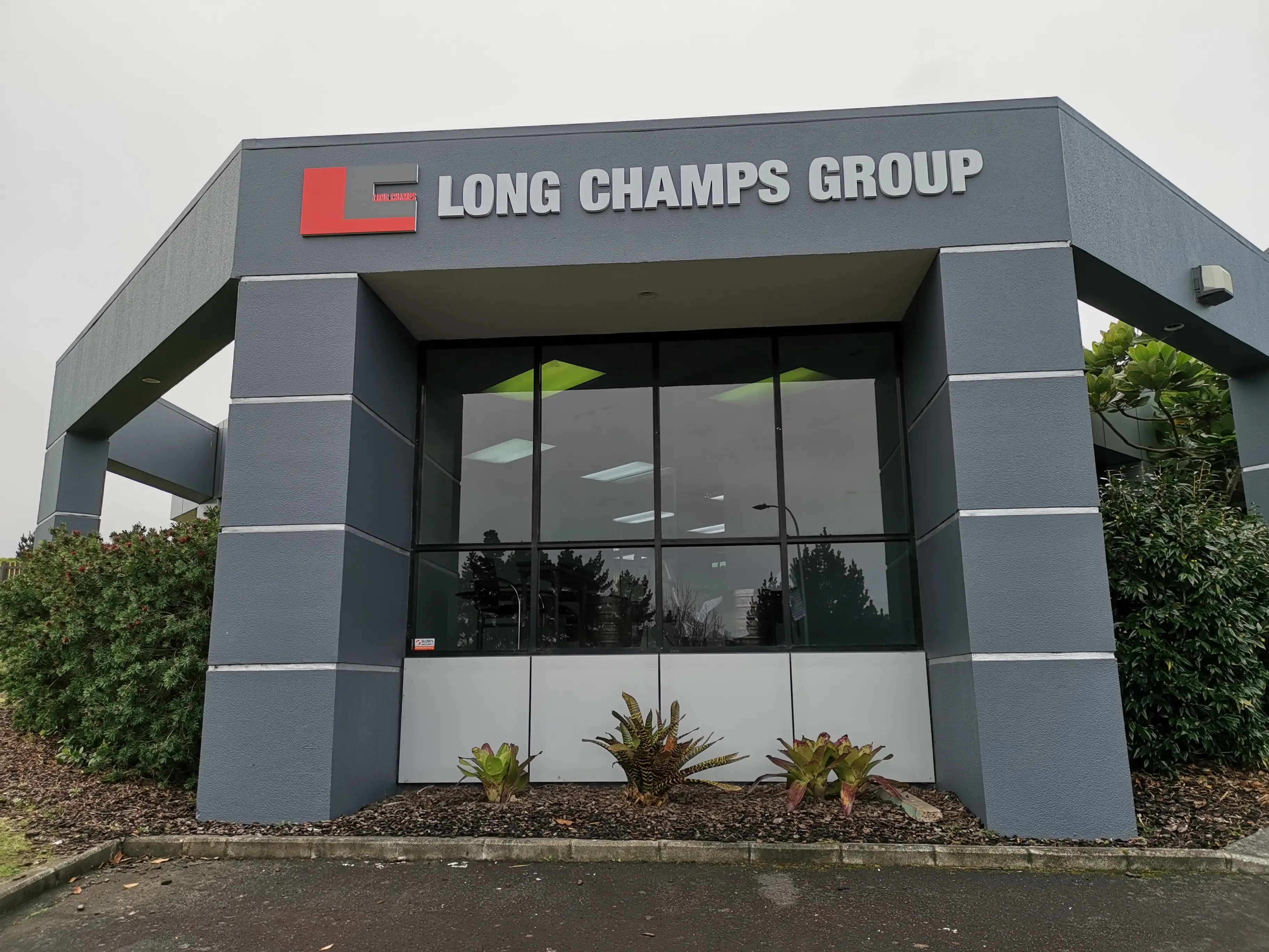 Long Champ Group meeting room with branded environmental graphics.