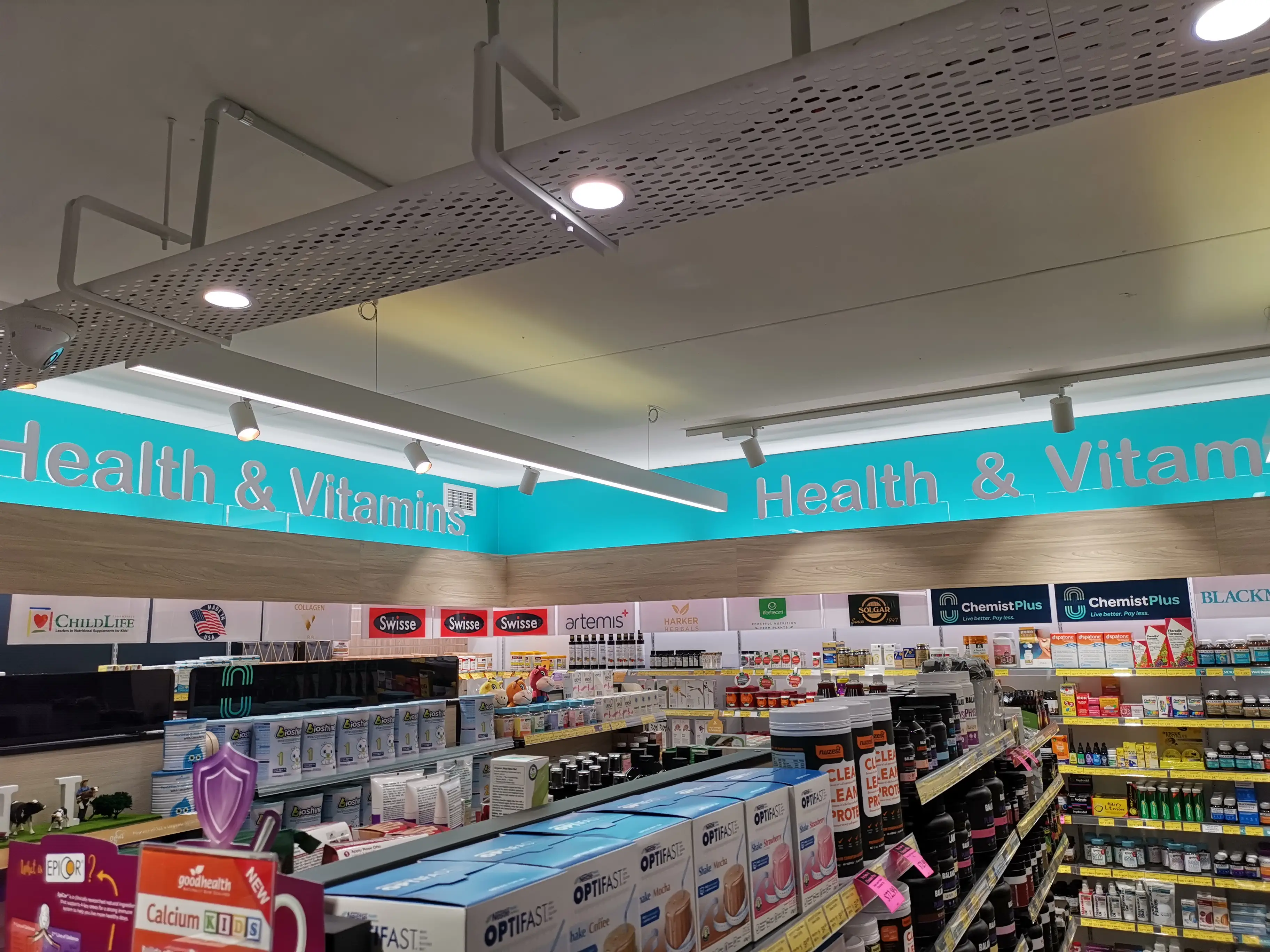 In-store aisle and directional signage.