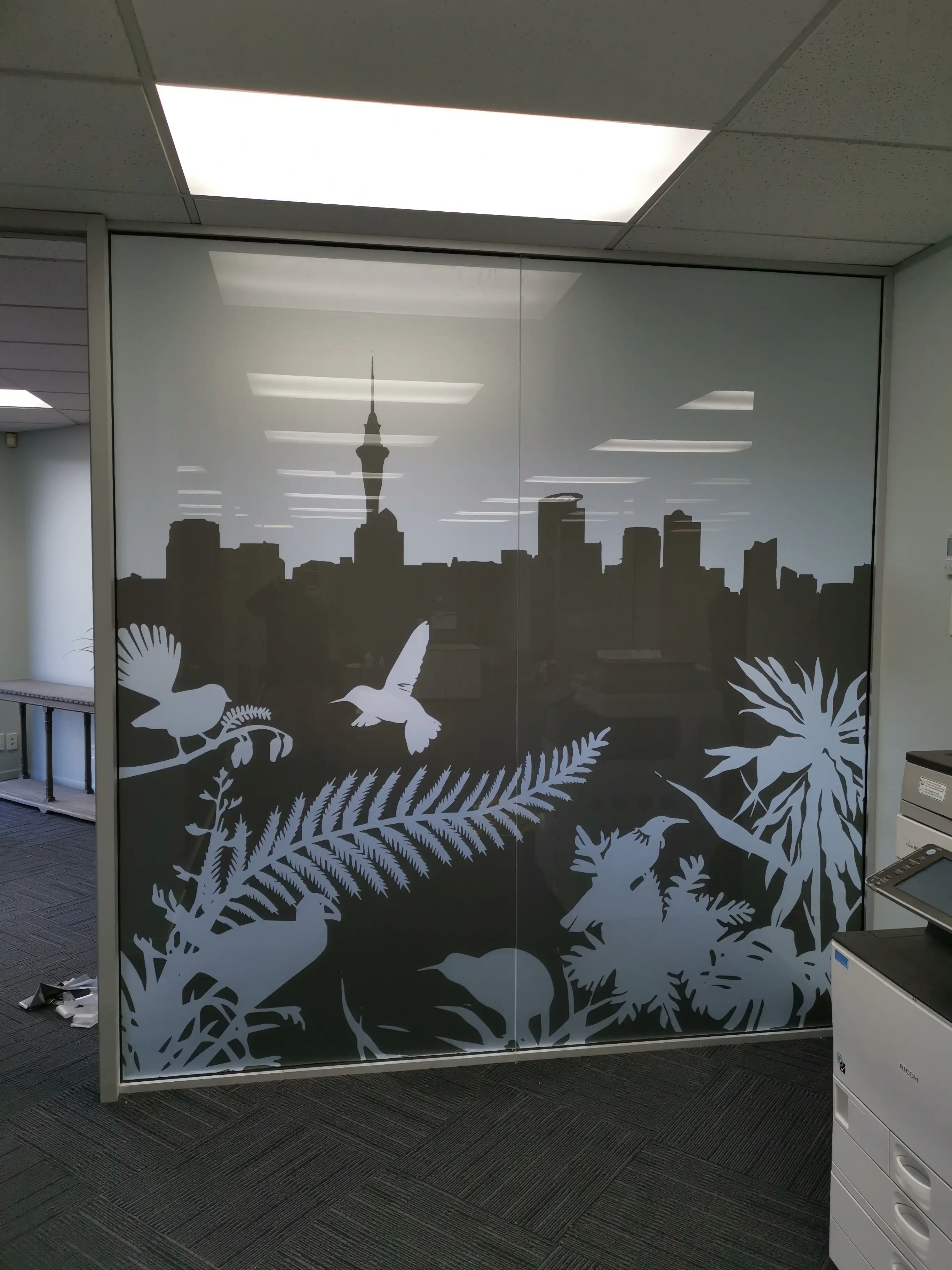 Long Champ Group meeting room with branded environmental graphics.