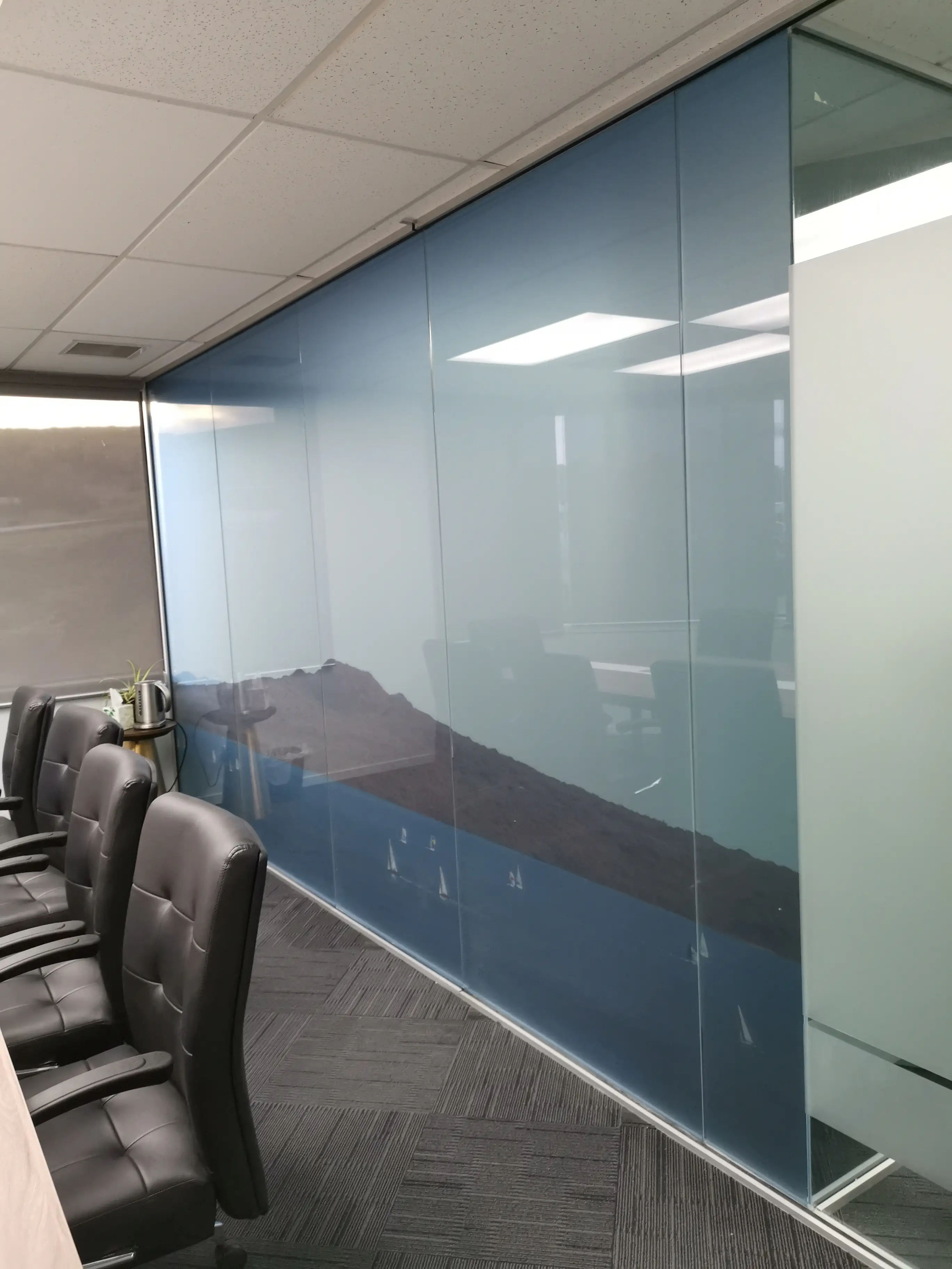 Glazed office partitions and interior identity details.