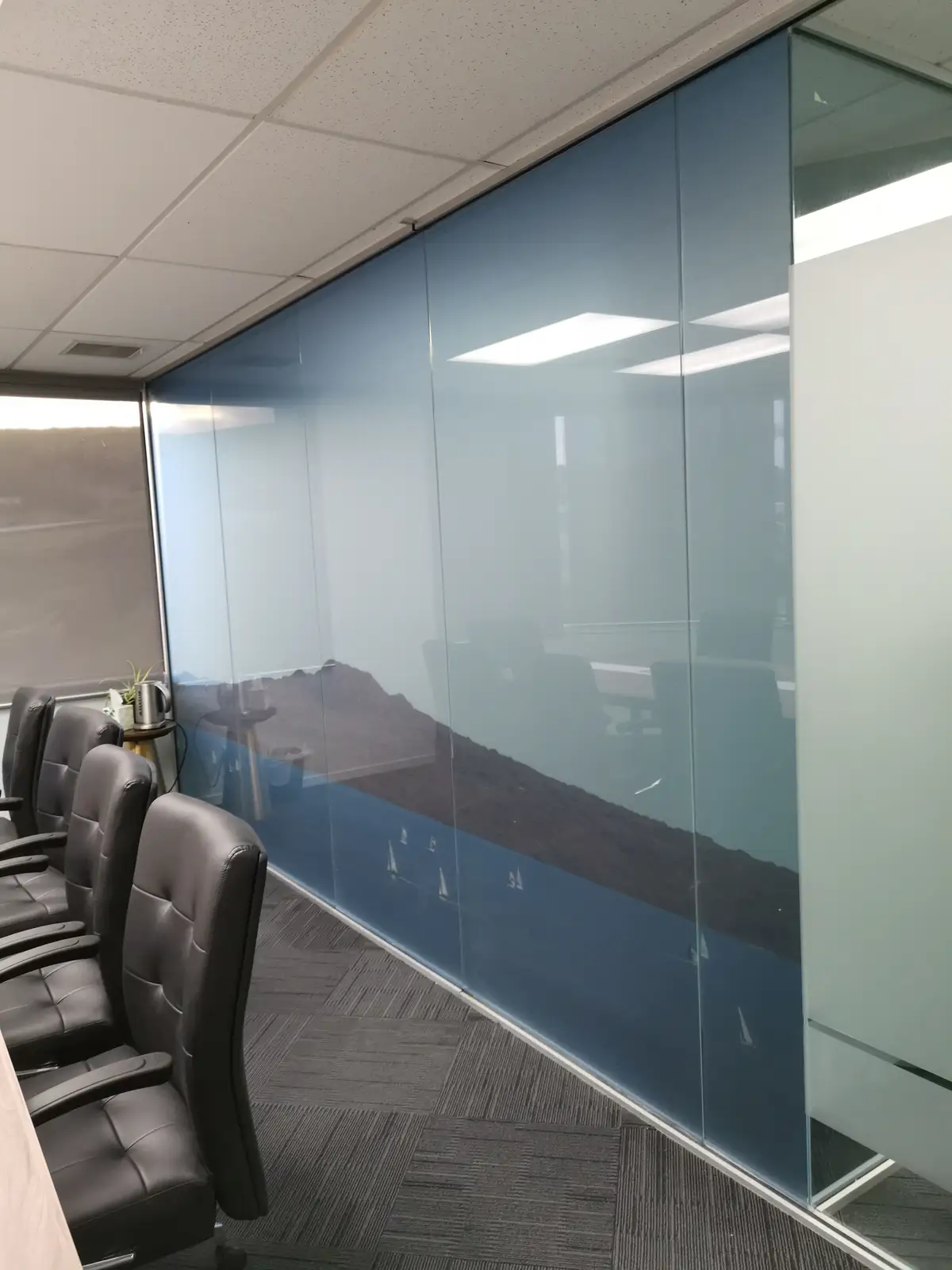 Glazed office partitions and interior identity details.