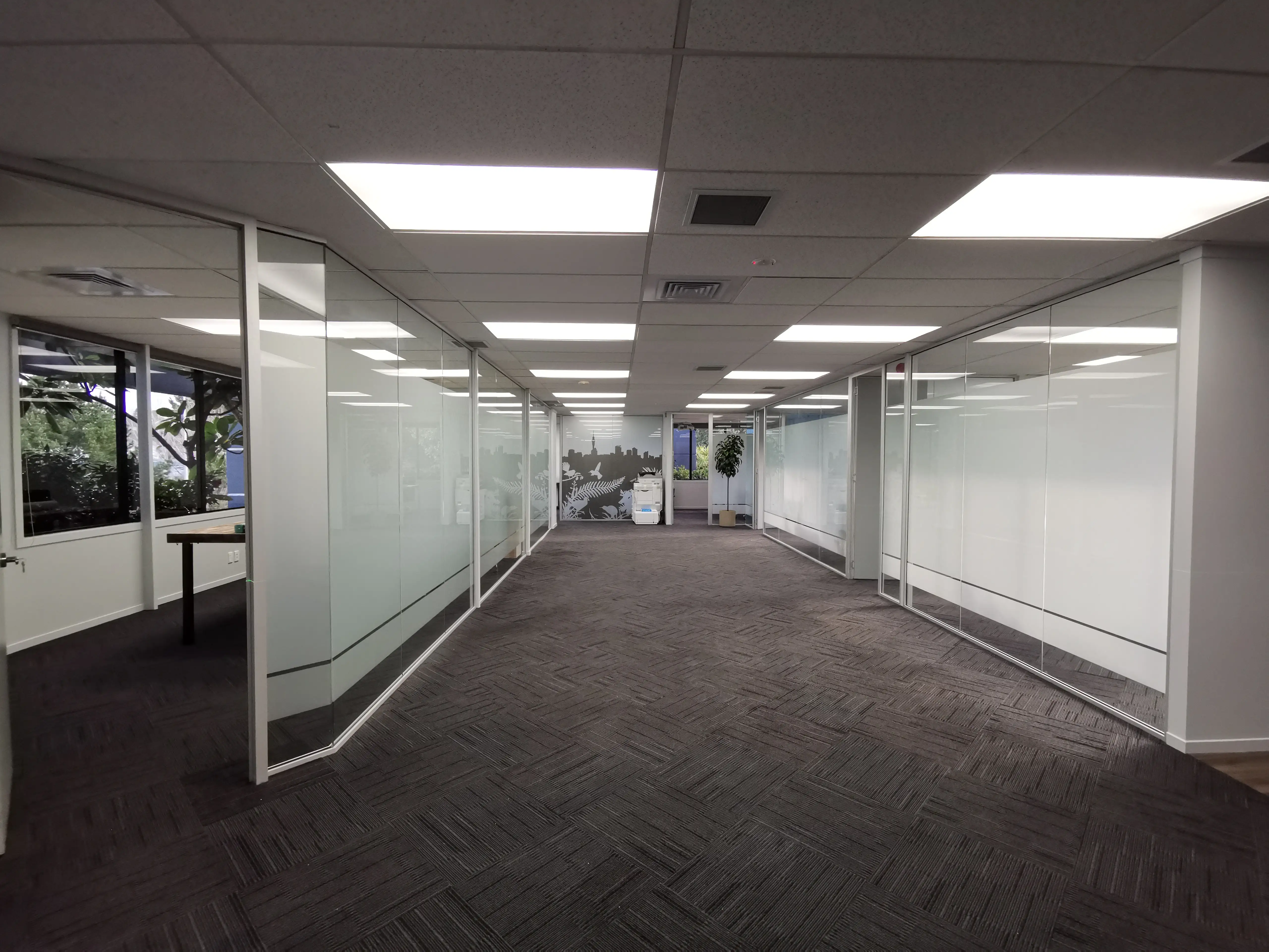 Long Champ Group meeting room with branded environmental graphics.