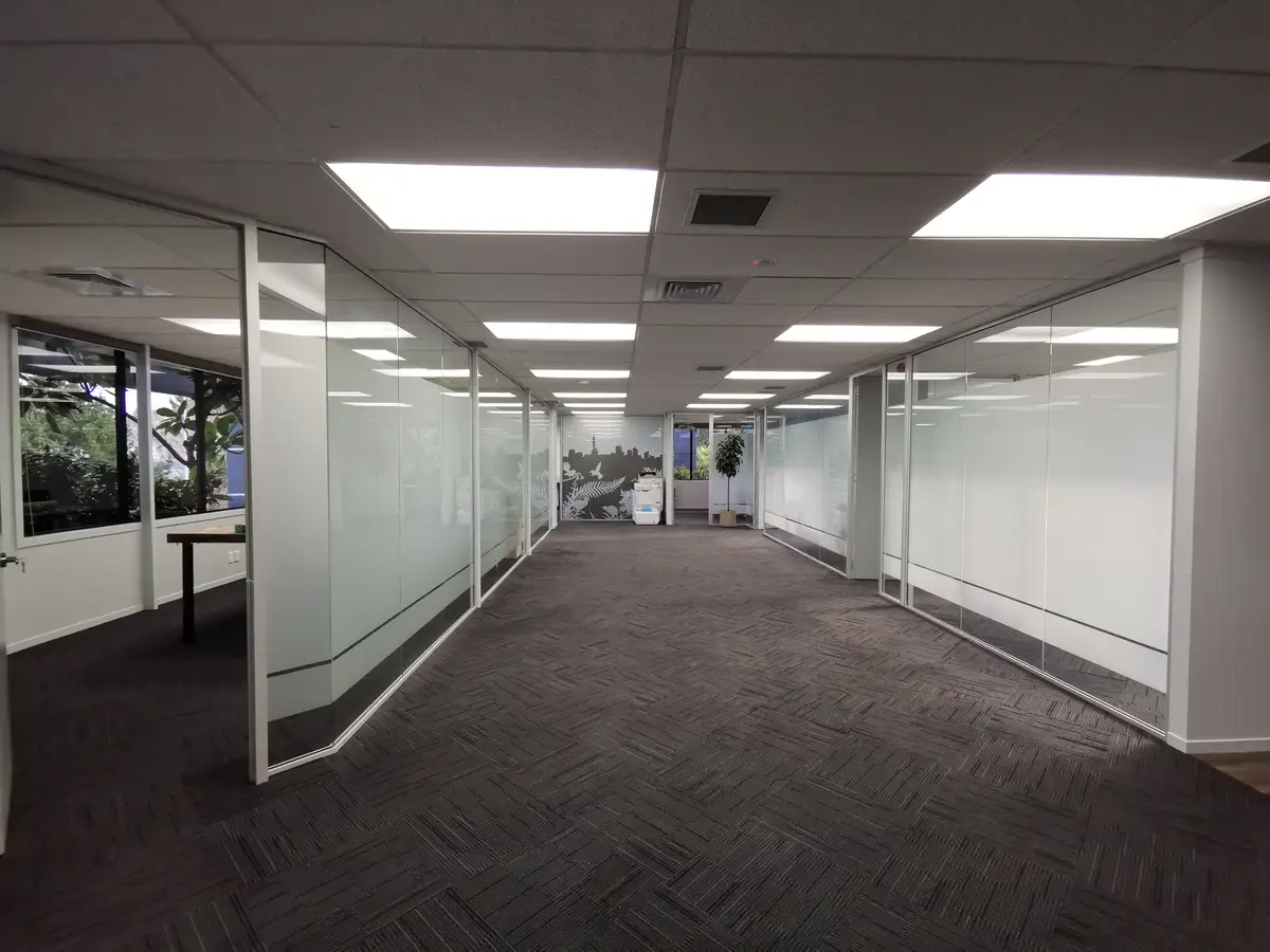 Long Champ Group meeting room with branded environmental graphics.