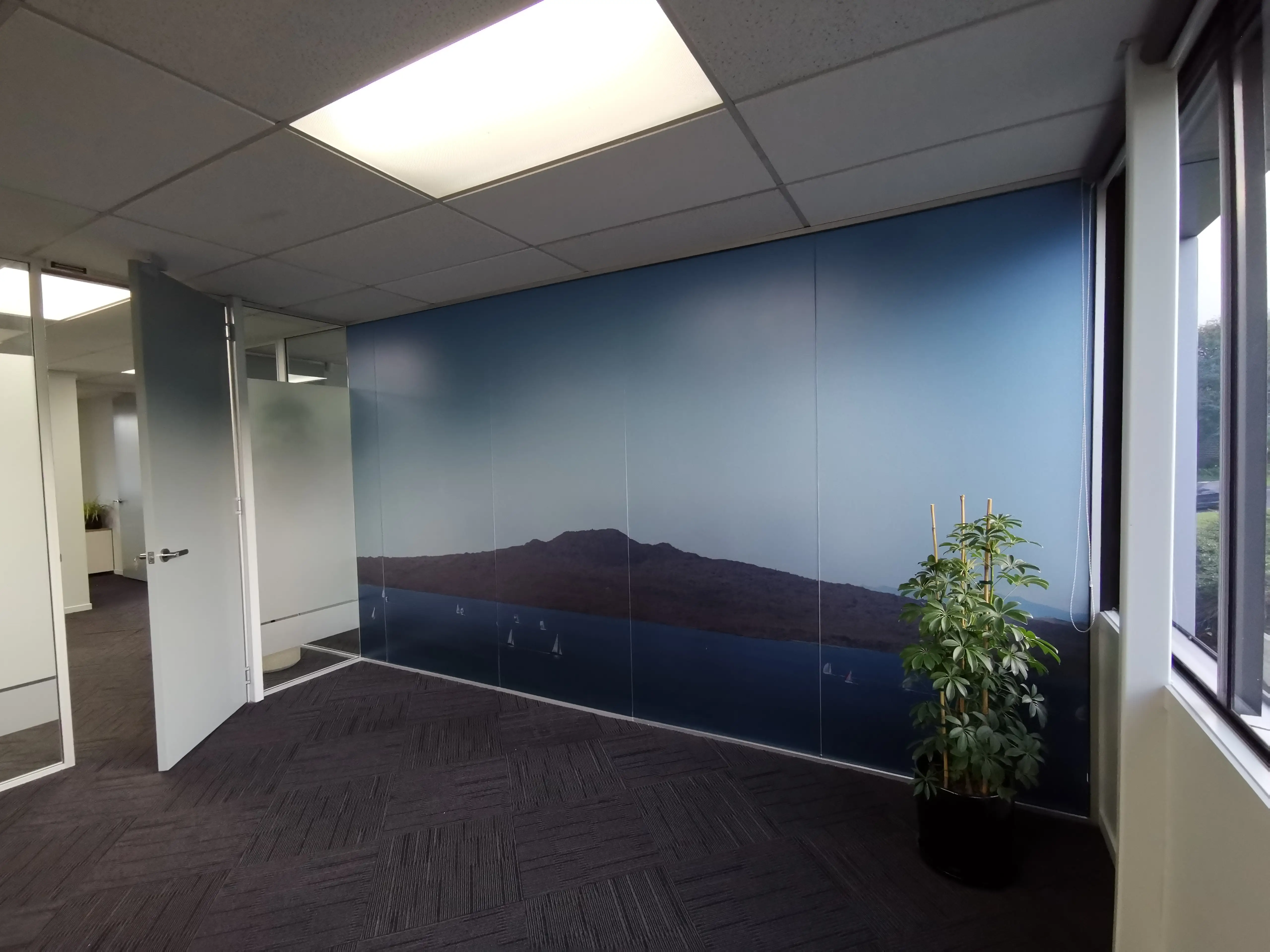 Glazed office partitions and interior identity details.