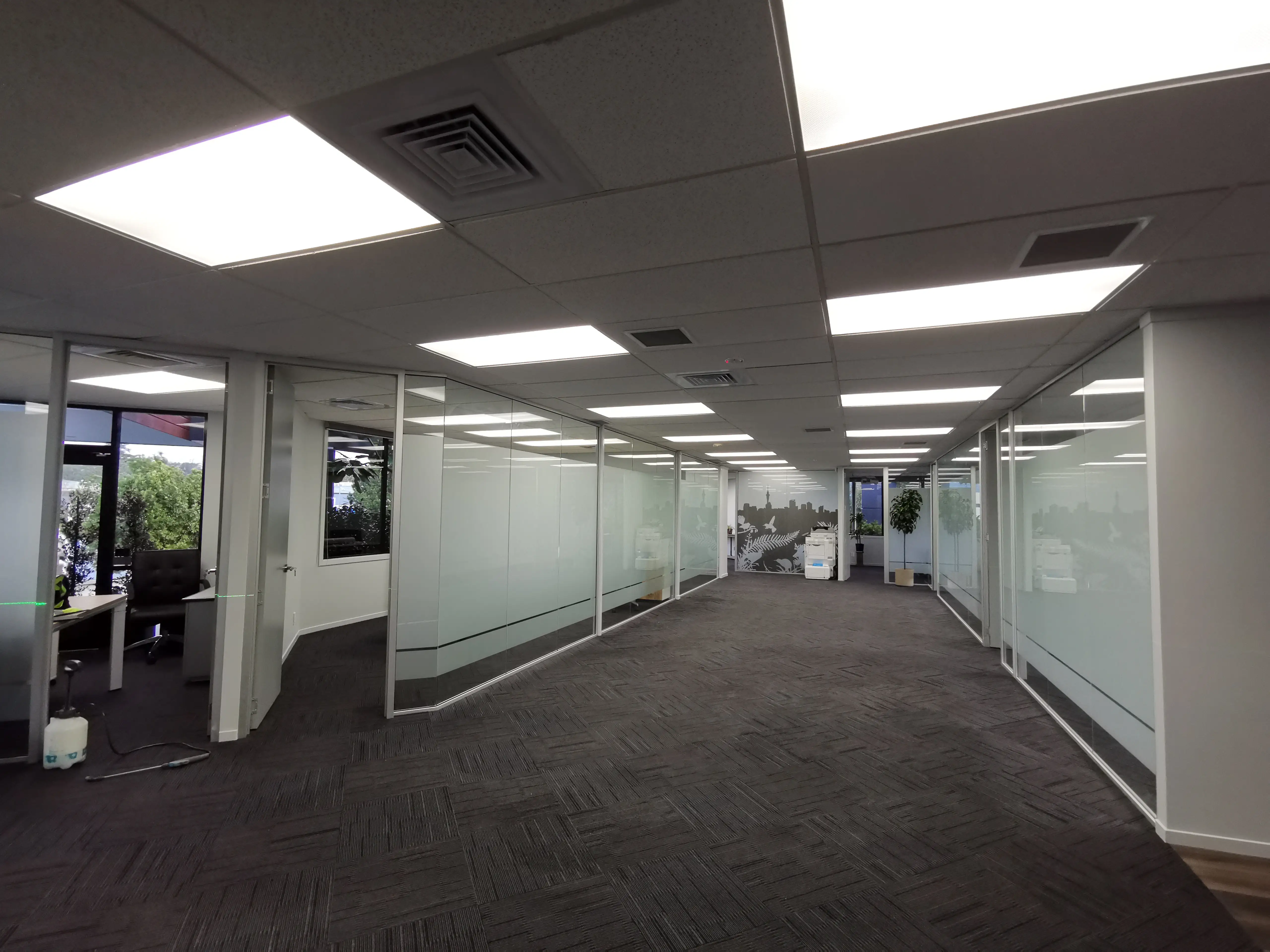Glazed office partitions and interior identity details.