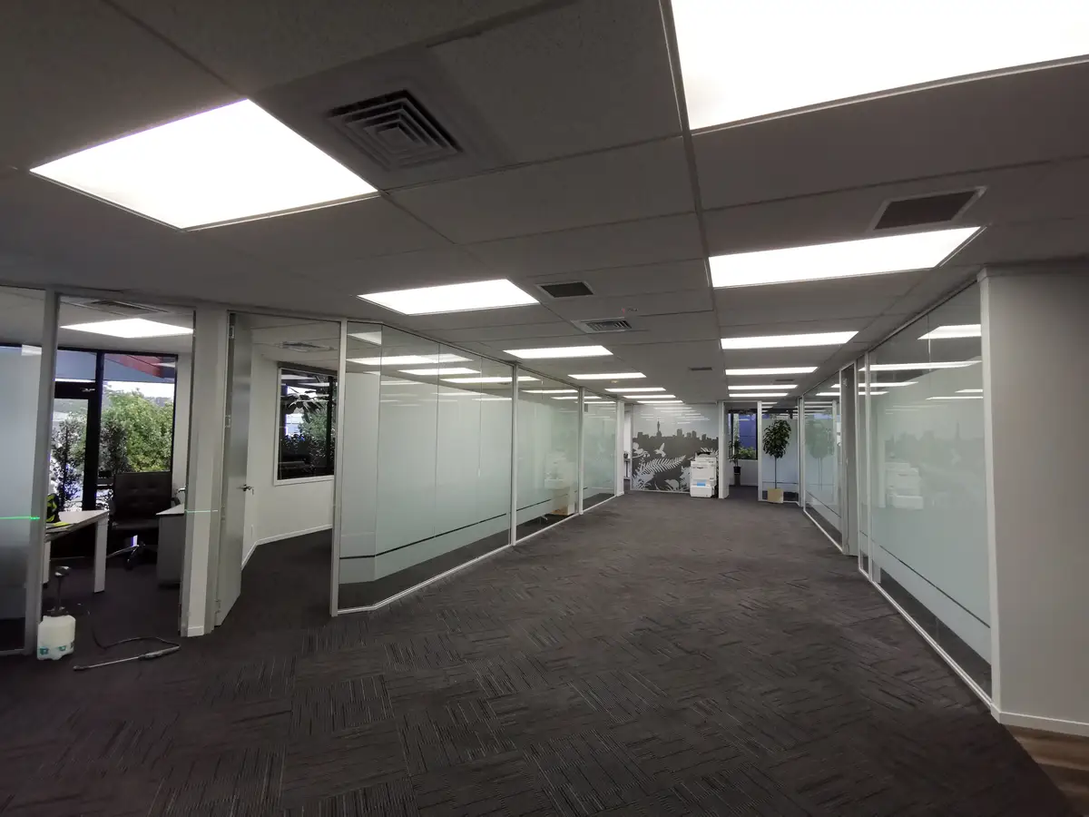 Glazed office partitions and interior identity details.