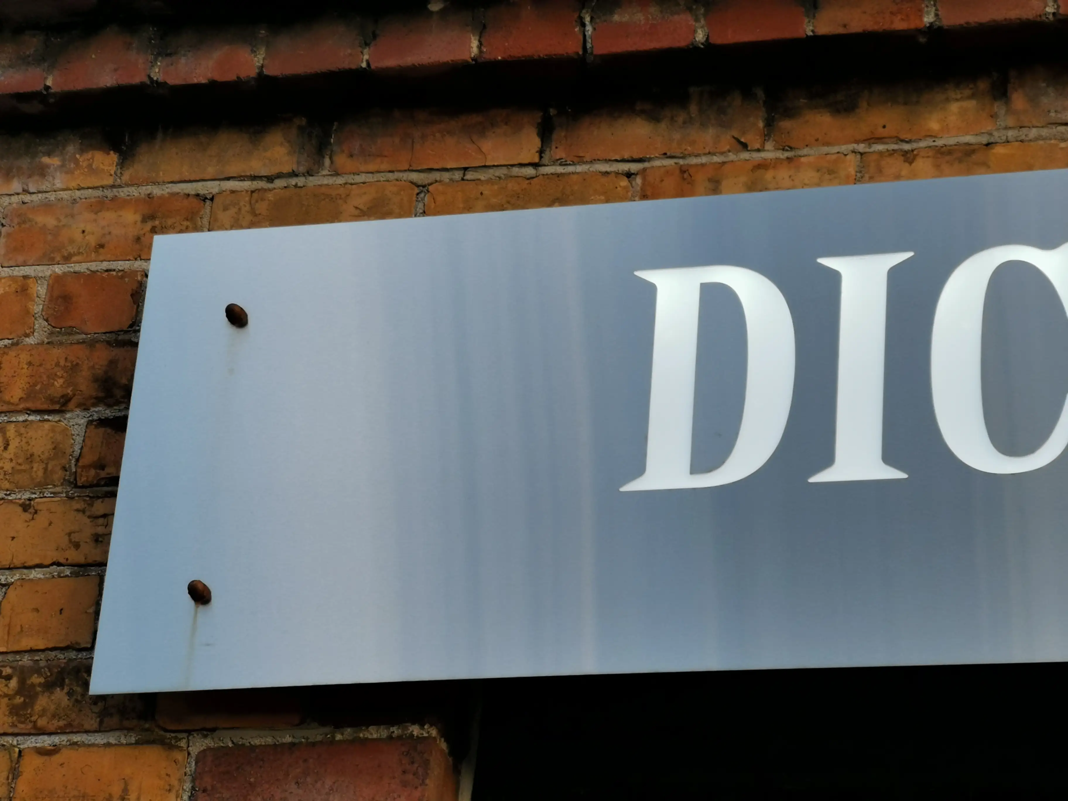 Completed wall-mounted brand application.