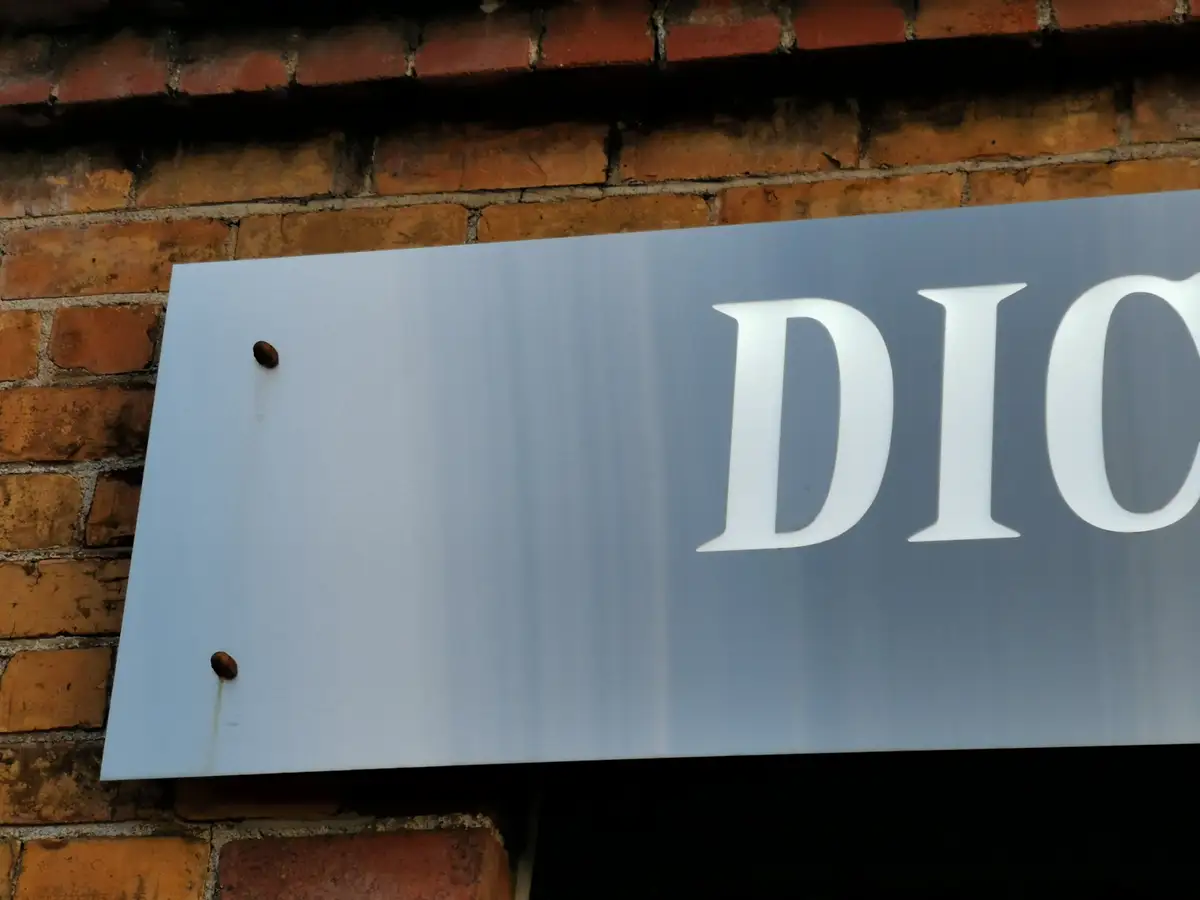 Completed wall-mounted brand application.