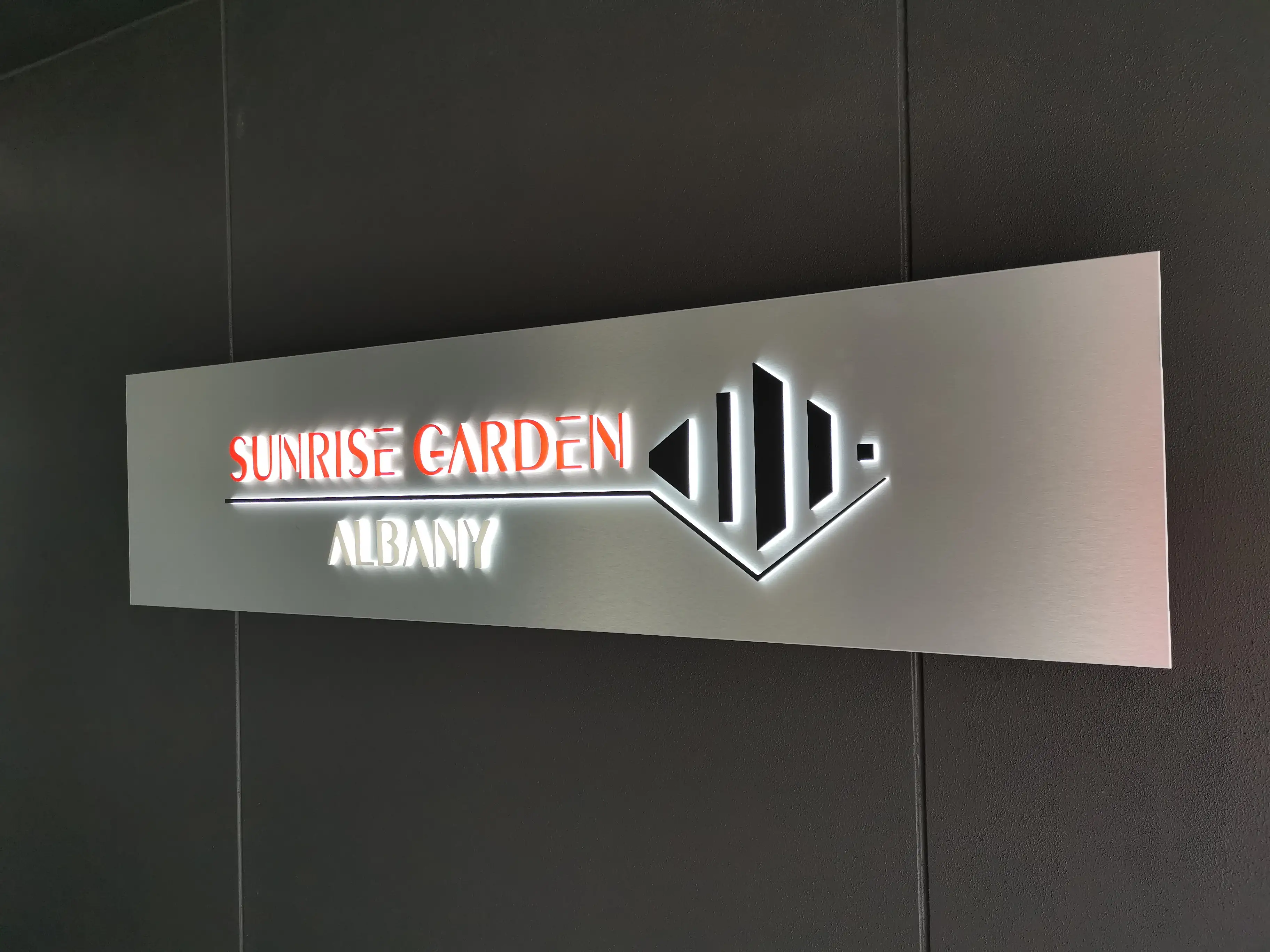 Sign construction and installed lettering details.