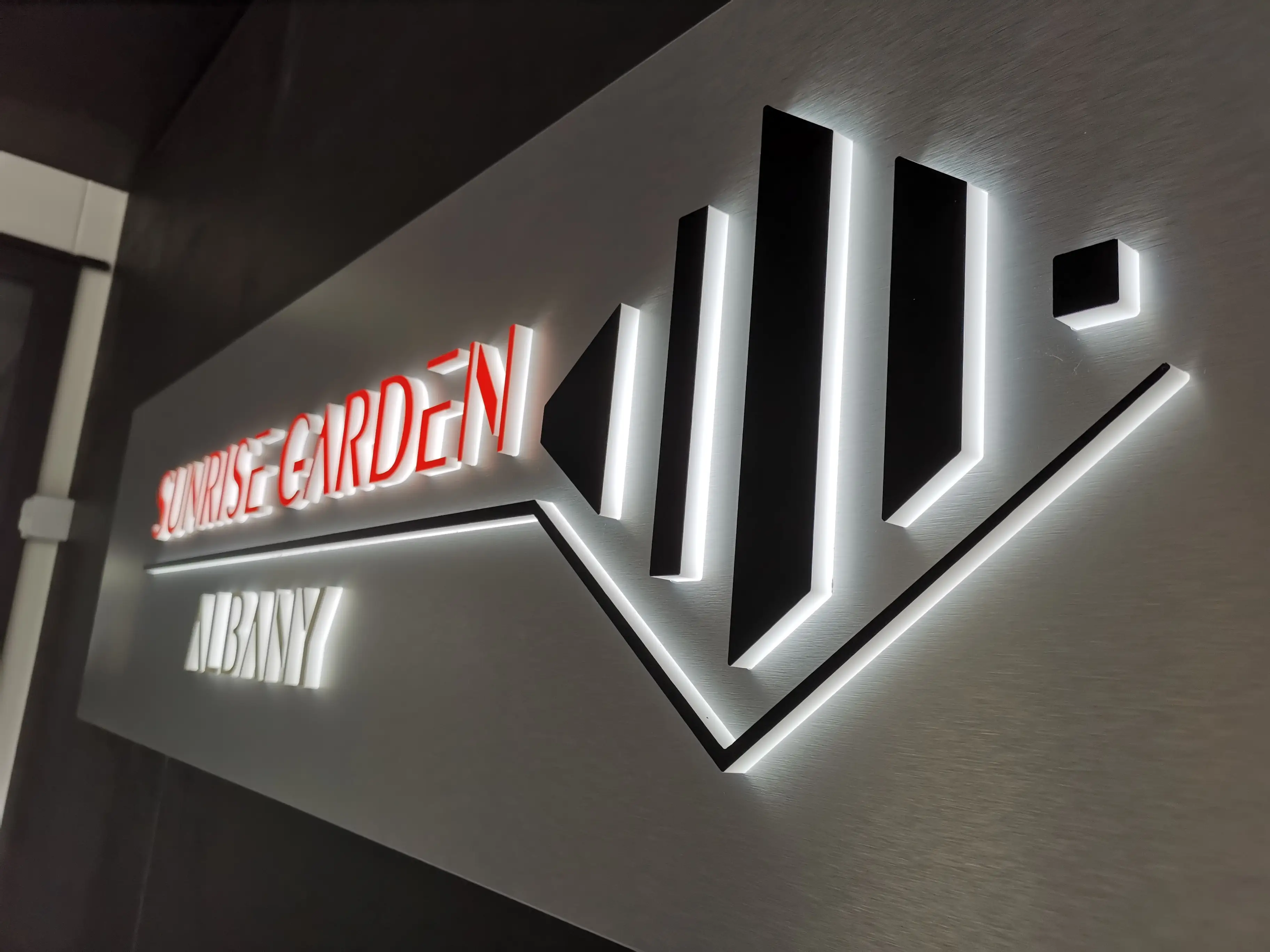 Sunrise Garden freestanding sign with dimensional red lettering.