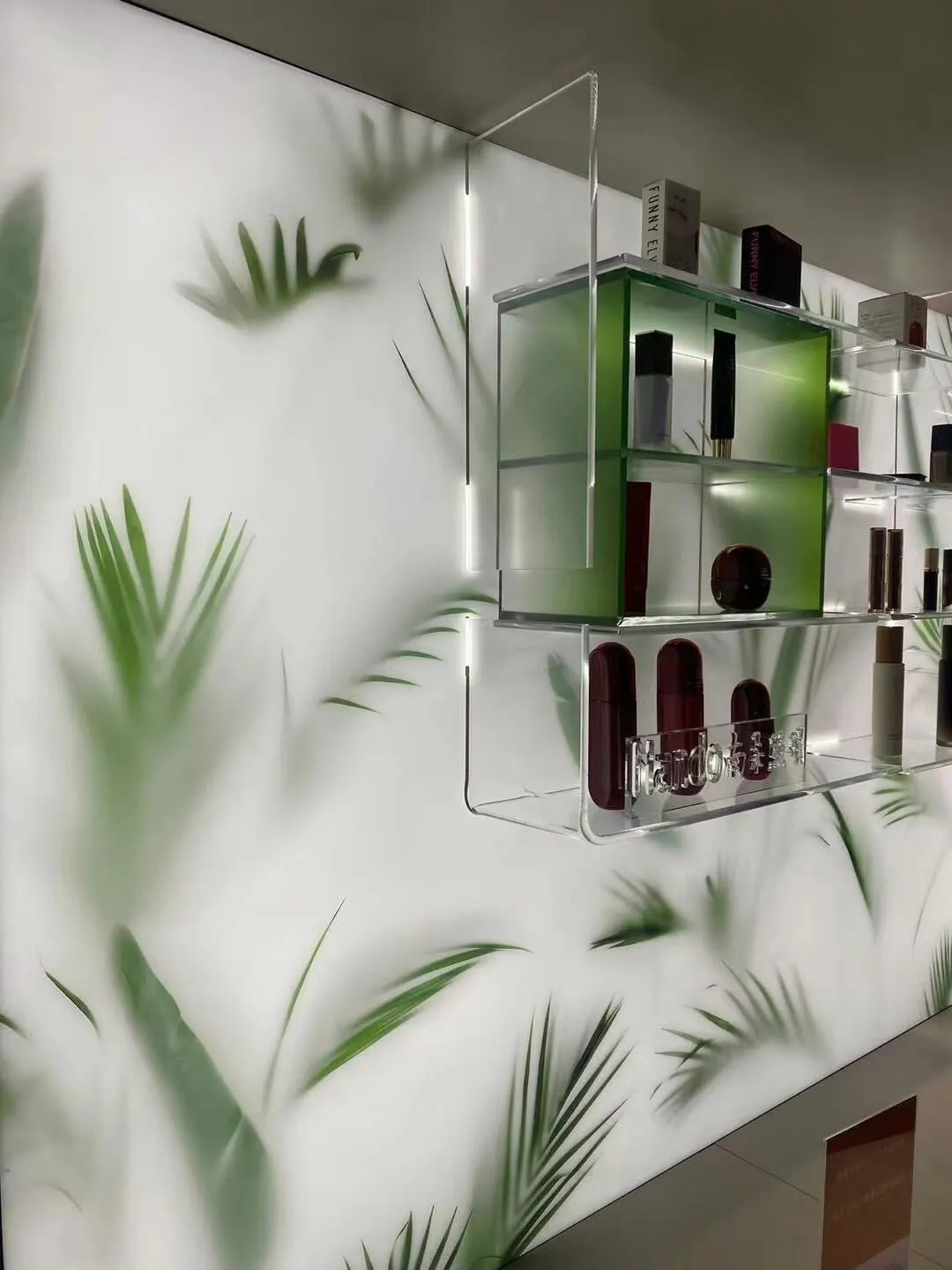 Translucent botanical resin panels integrated with illuminated retail display shelving