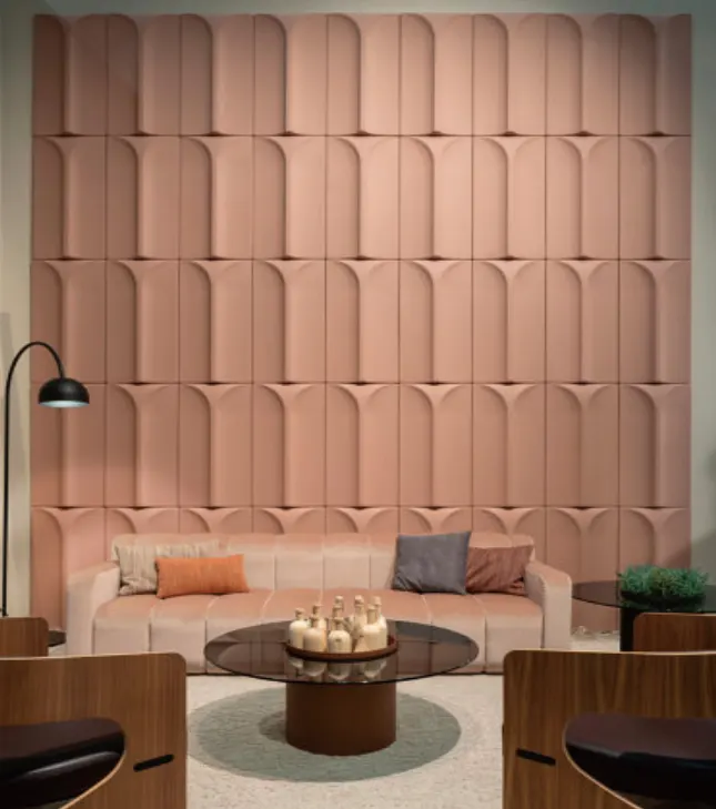 Supplier reference showing soft-pink Yuri three-dimensional wall tiles in a lounge setting